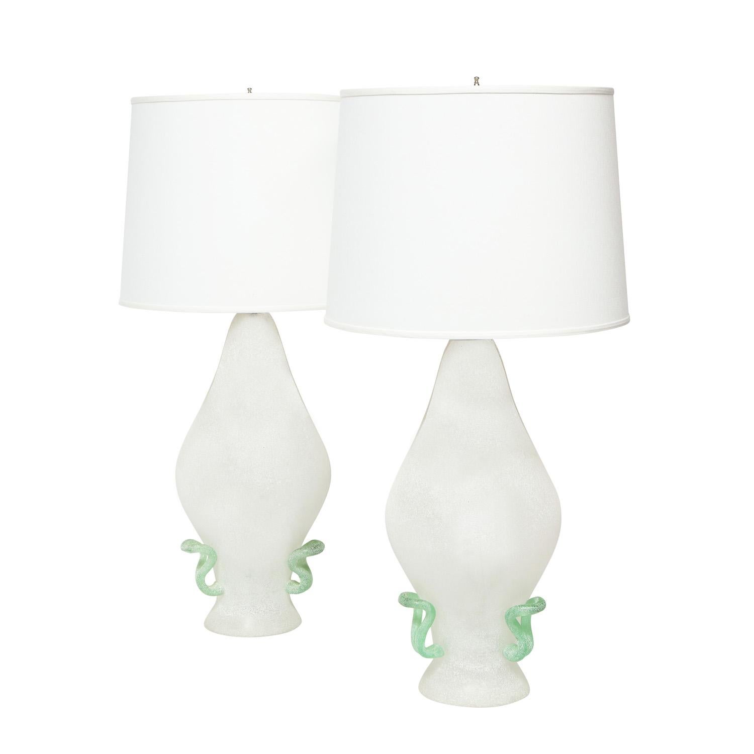 Pair of artisan hand-blown glass table lamps, with white scavo finish and green accents, by Cenedese, Murano Italy, 1970's. The forms and colors are beautiful.

Measures: Shade Diameter: 16 inches
Shade High: 12 inches.