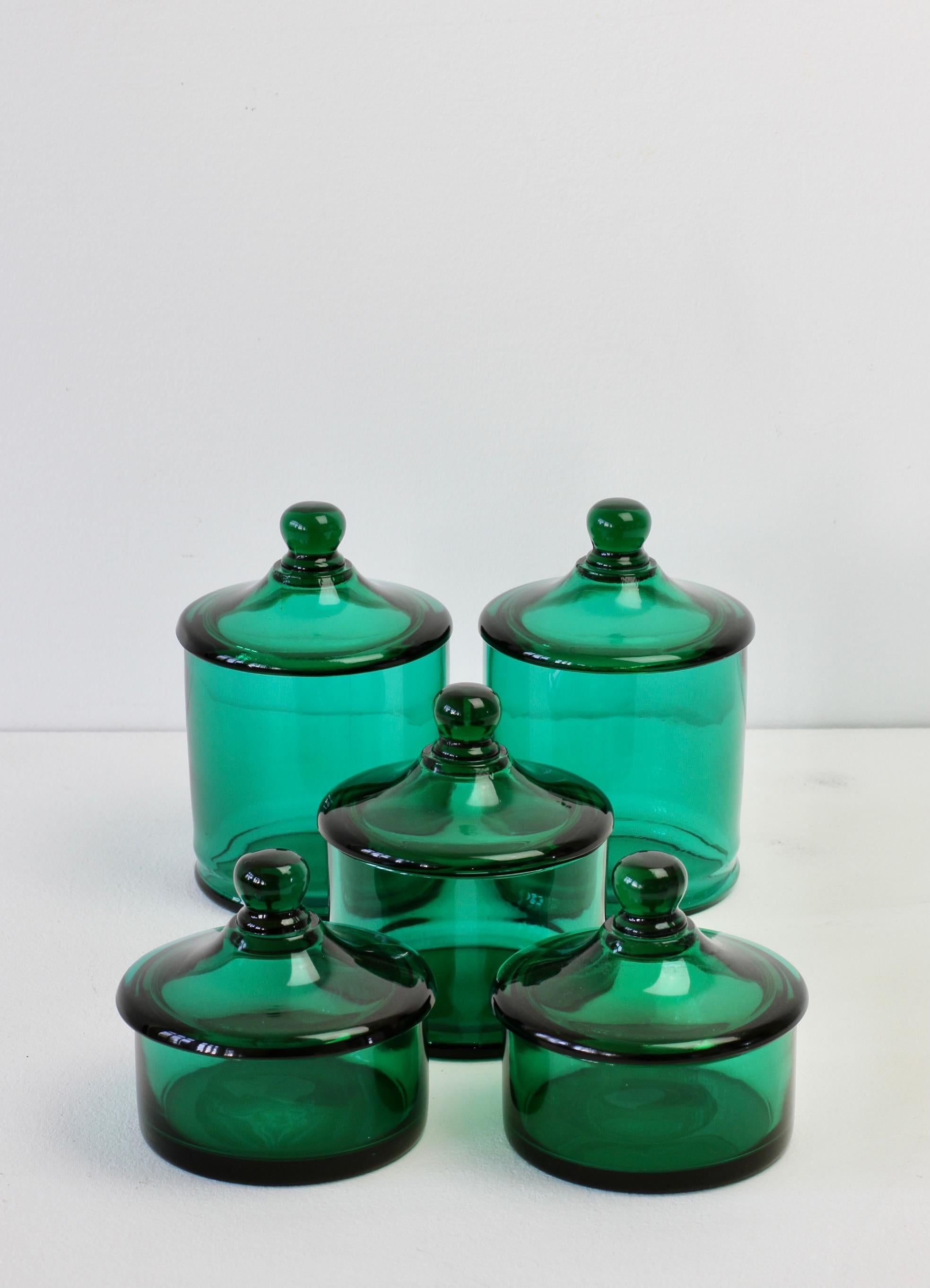 Rare set of five Venetian Murano green colored / coloured glass Apothecary jars or urns with lids. Wonderful vintage Mid-Century Italian glass and perfect for the storage sweets or snacks in the kitchen or for cotton wool buds or cosmetics in a