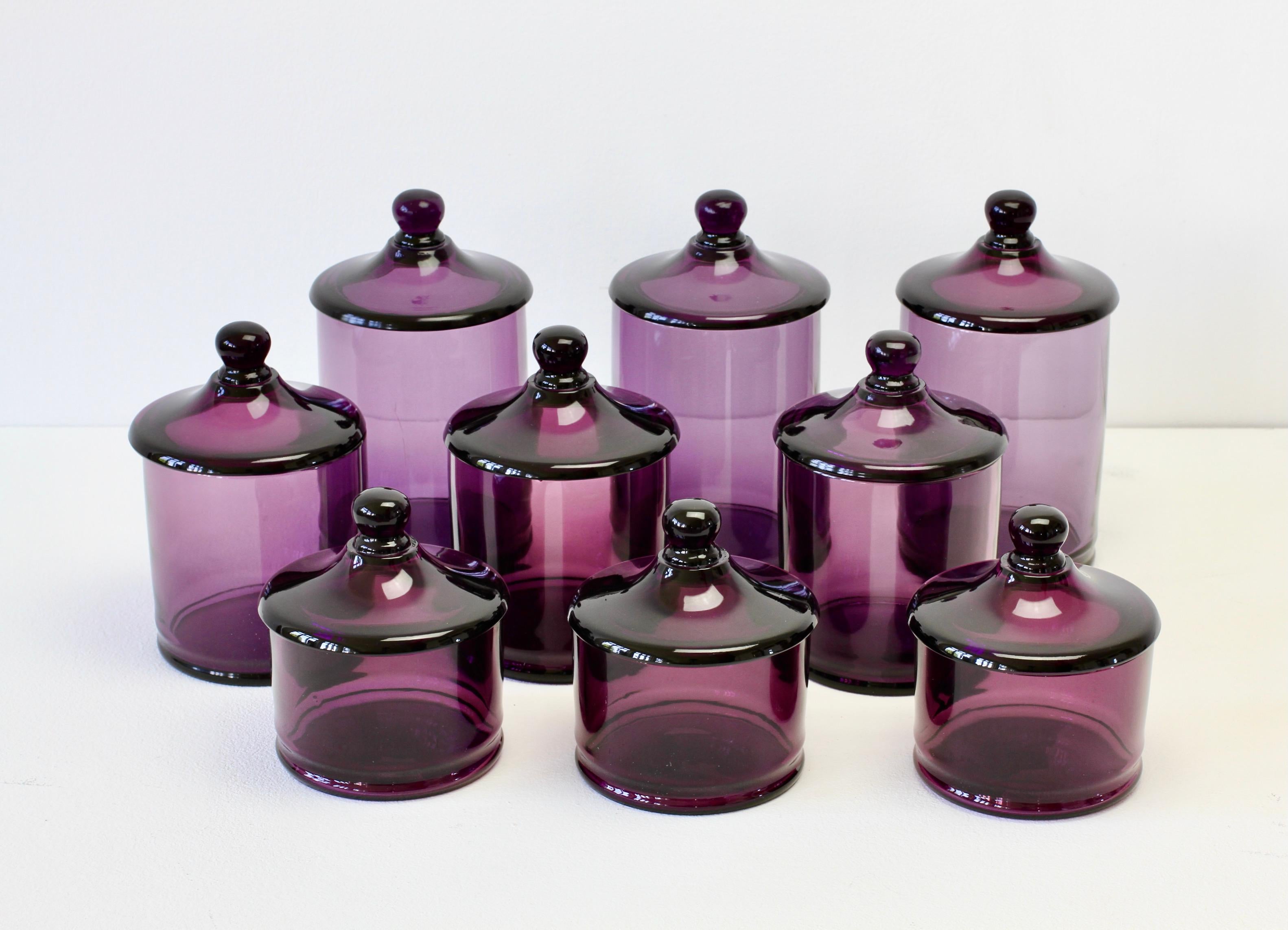 Rare set of nine Venetian Murano purple colored / colored glass Apothecary jars or urns with lids. Wonderful vintage Mid-Century Italian glass and perfect for the storage sweets or snacks in the kitchen or for cotton wool buds or cosmetics in a