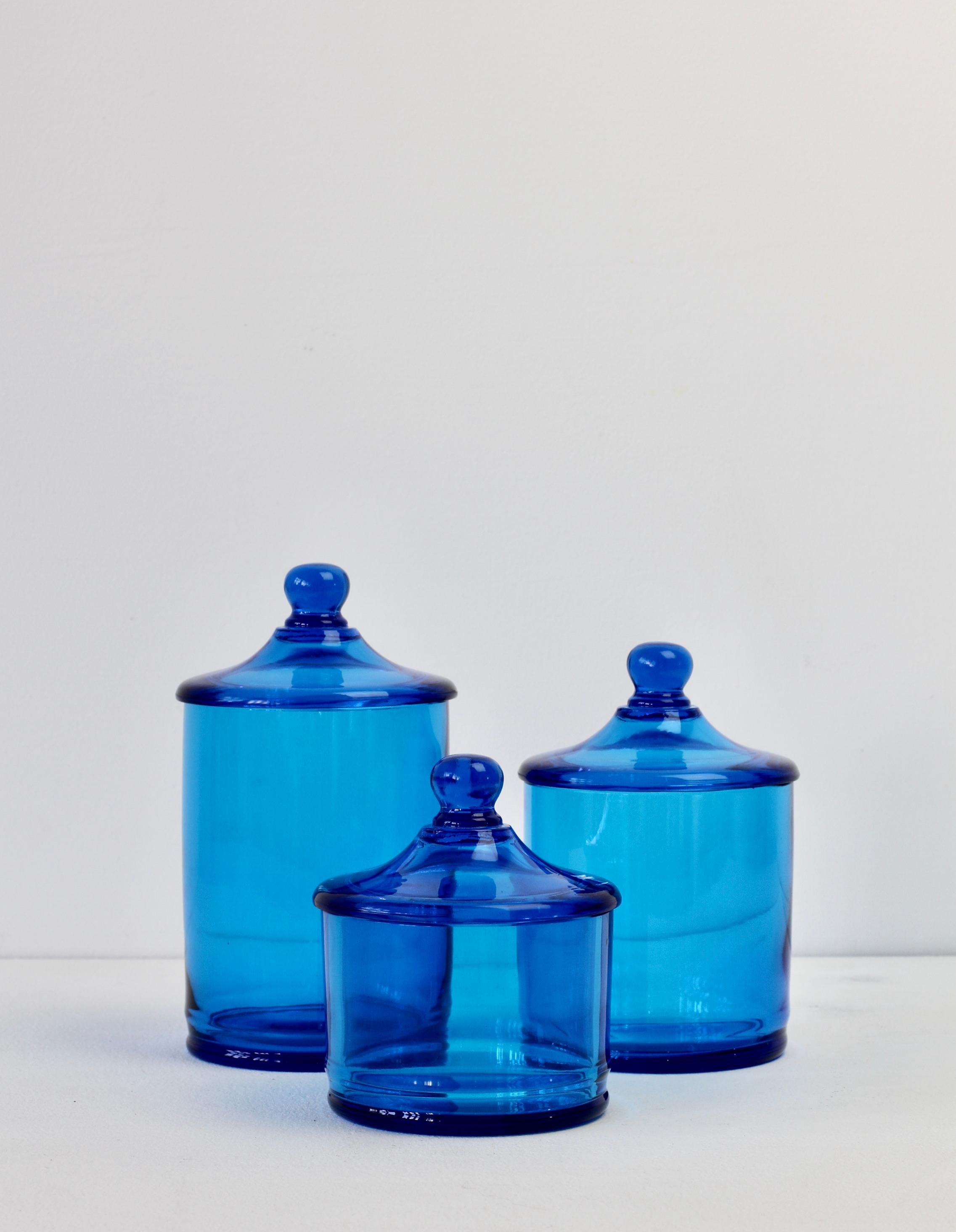 Rare set of three Venetian Murano blue colored / coloured glass Apothecary jars or urns with lids. Wonderful vintage Mid-Century Italian glass and perfect for the storage sweets or snacks in the kitchen or for cotton wool buds or cosmetics in a