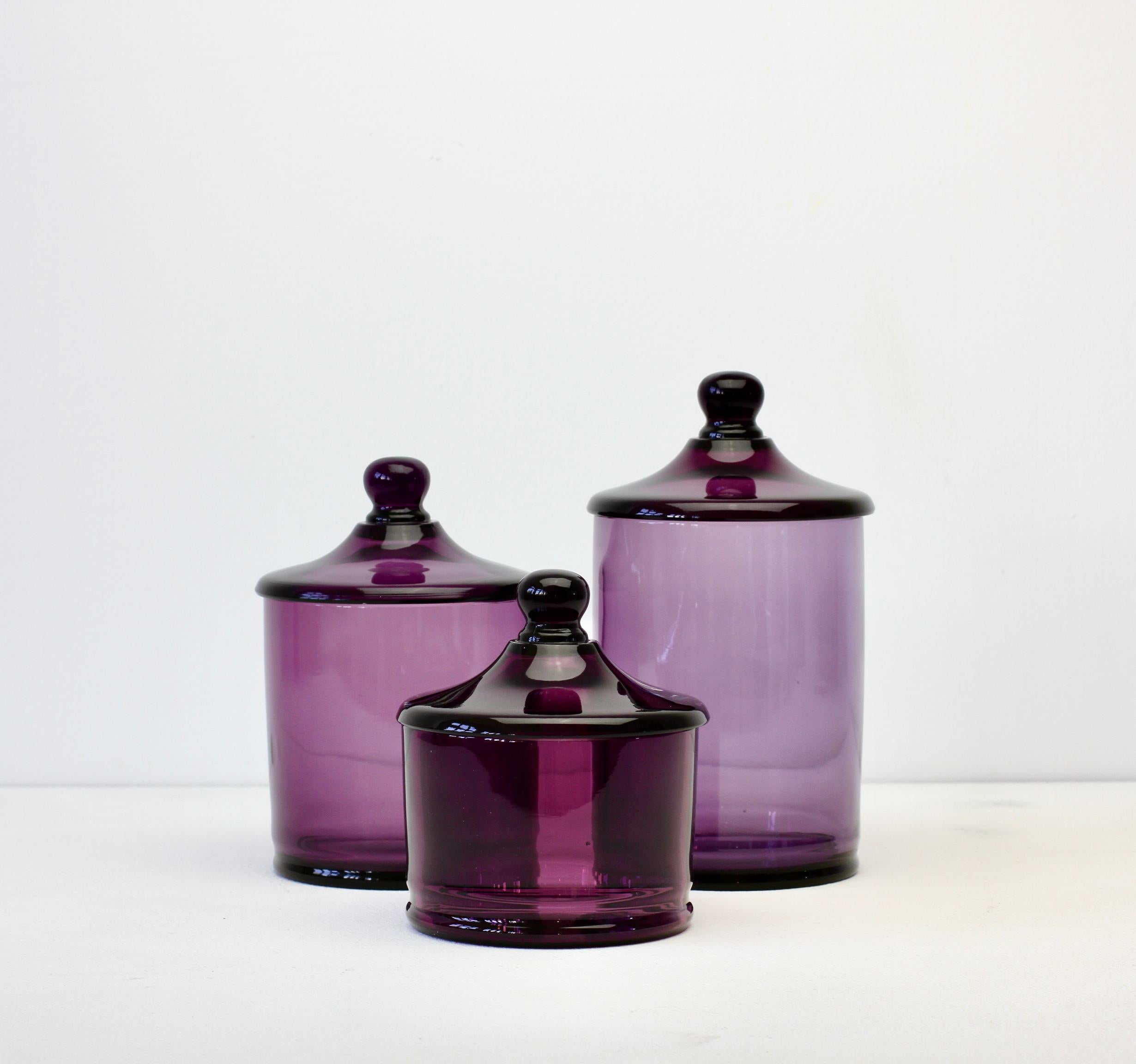 Rare set of three Venetian Murano purple colored / coloured glass Apothecary jars or urns with lids. Wonderful vintage Mid-Century Italian glass and perfect for the storage sweets or snacks in the kitchen or for cotton wool buds or cosmetics in a