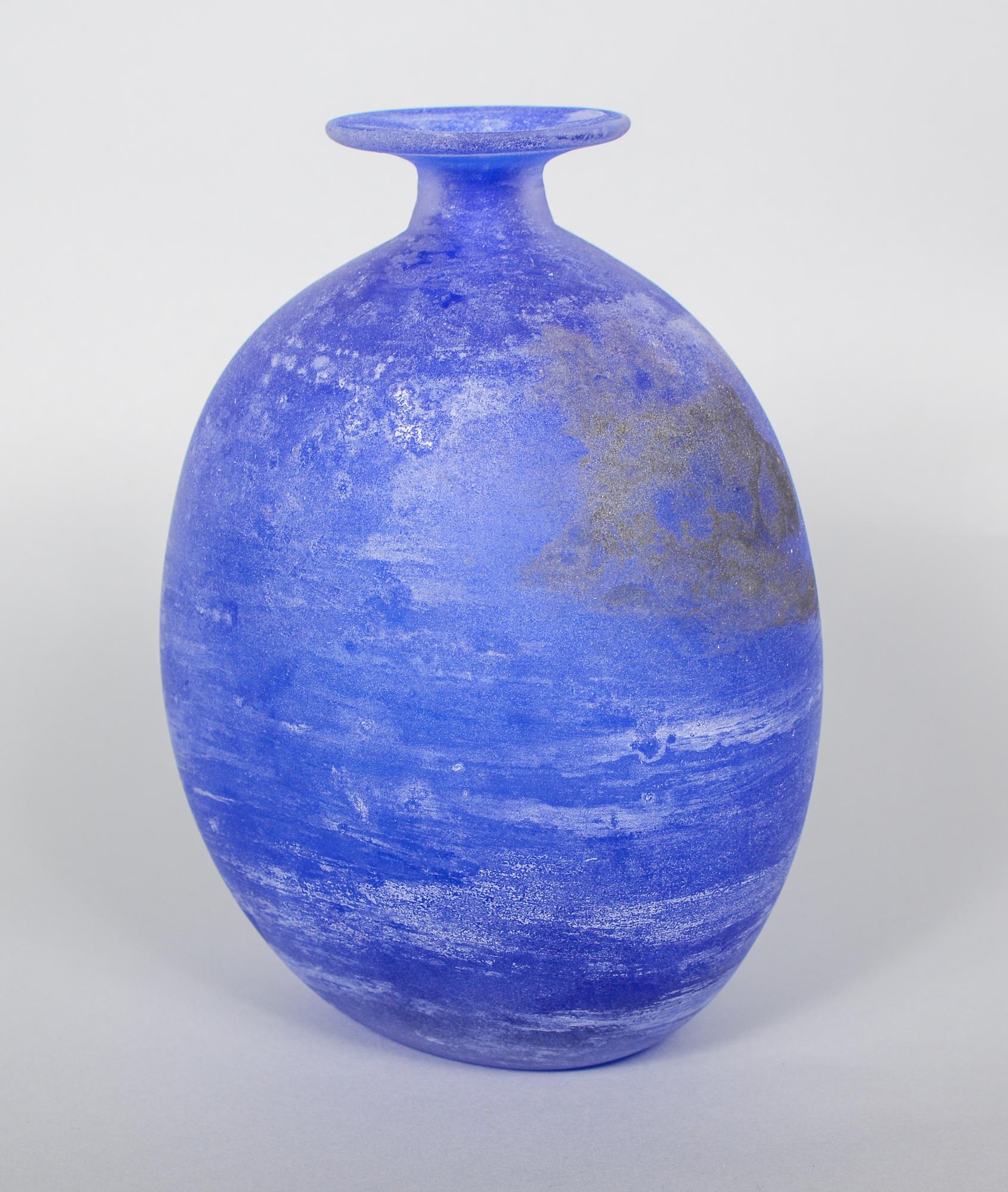Cenedese glass in a bulbous bottle form. The glass is in the scavo technique that is meant to look like excavated ancient glass.