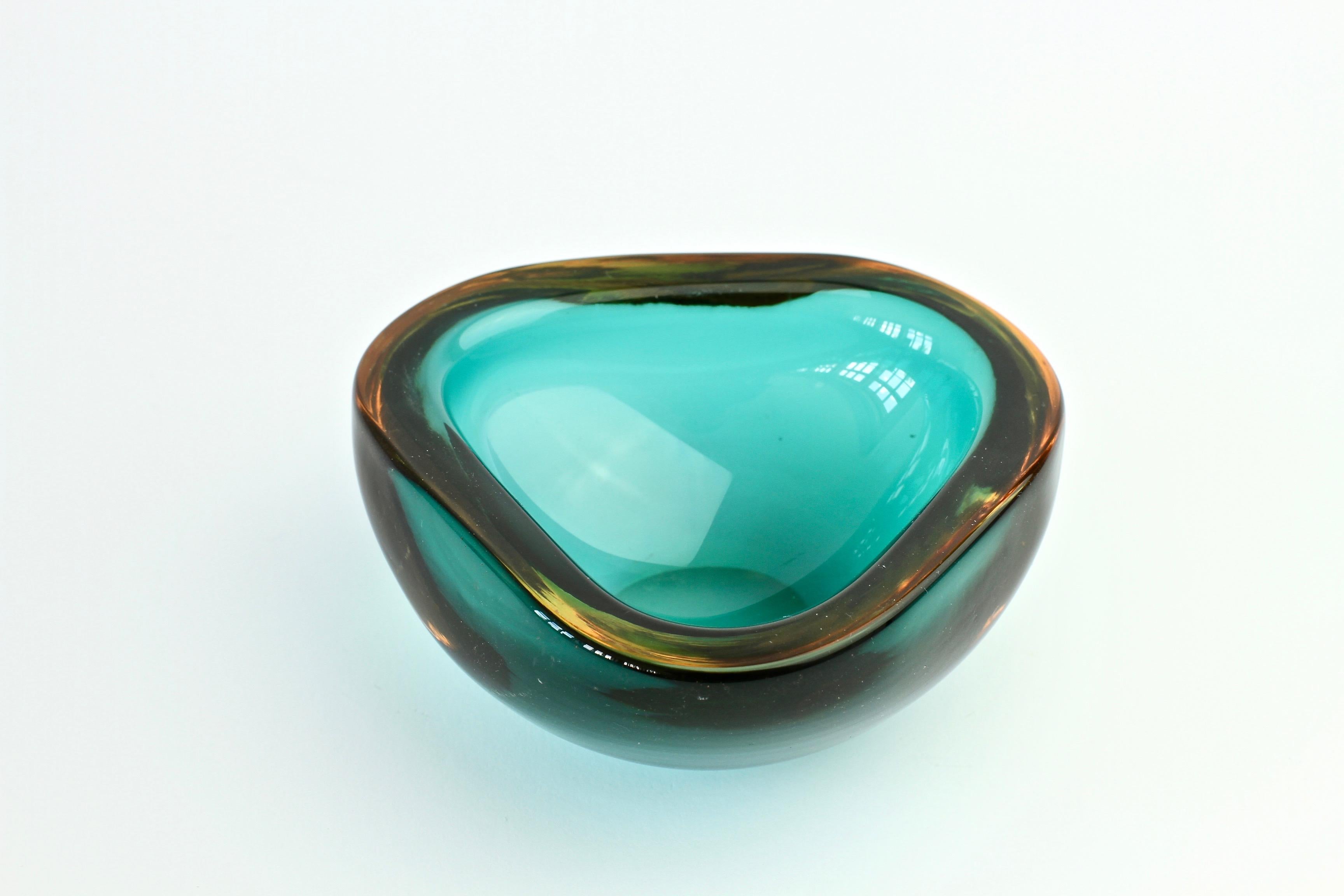 A beautiful Murano glass bowl signed by Cenedese, circa 1960. Beautifully understated and elegantly simple Amber and emerald green 'Sommerso' glass, resulting is a simply mesmerizing piece of midcentury Italian art glass.

