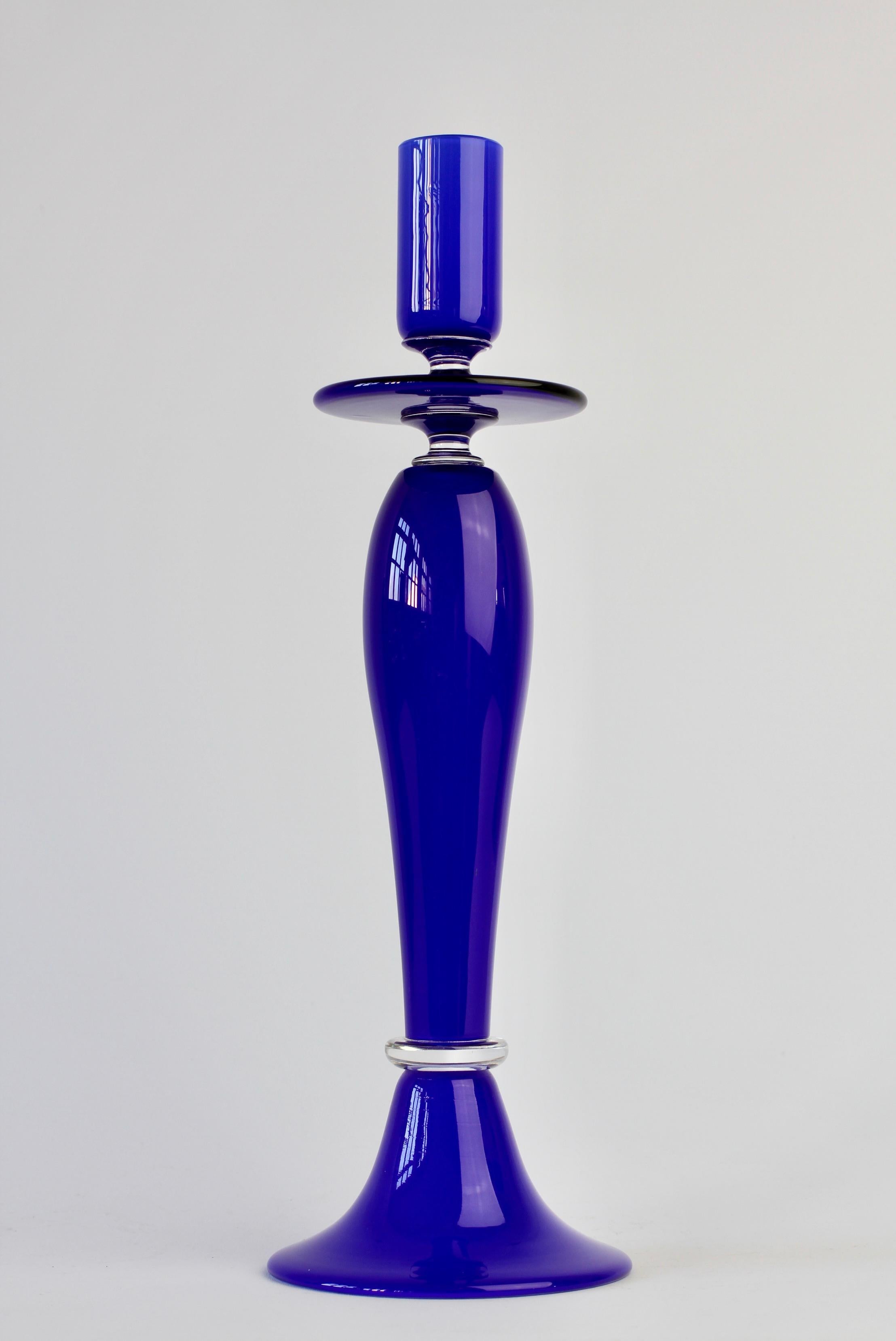 Cobalt blue colored (colored) and clear Italian Murano glass candlestick holder 'signed' by Cenedese with original labels. Beautiful craftsmanship and stunning color.

Candleholder measures - 32cm (12.59 inches) by 10.3cm (4.03inches) at the