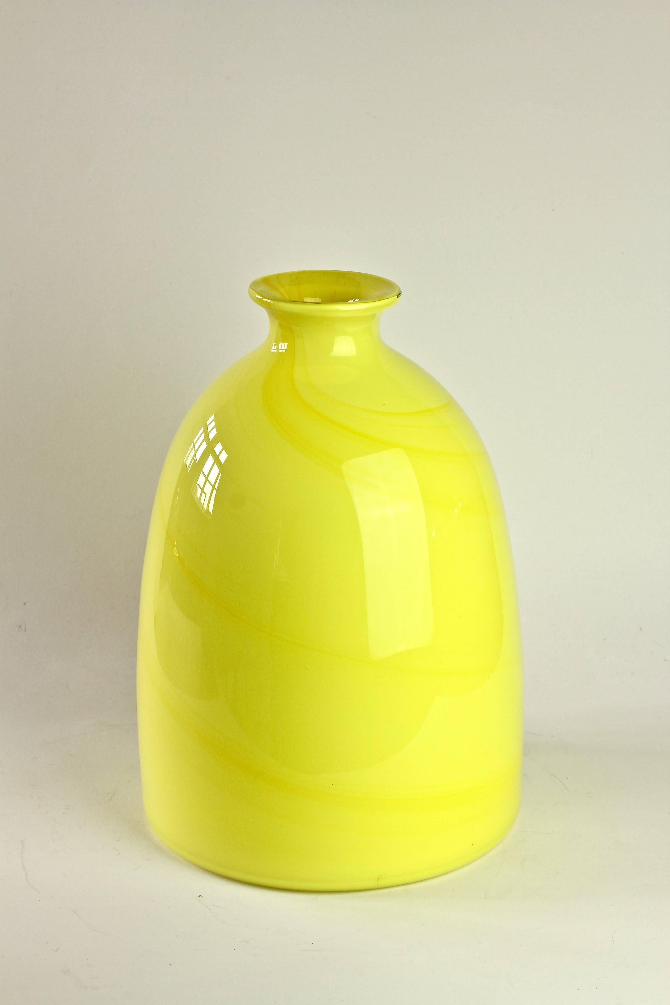 Wonderfully colourful / colorful tall bright yellow vase by Cenedese Vetri of Murano, Italy. Particularly striking is the form - with it's flat base and narrow neck - it has all the characteristics of a piece of hand thrown pottery with the