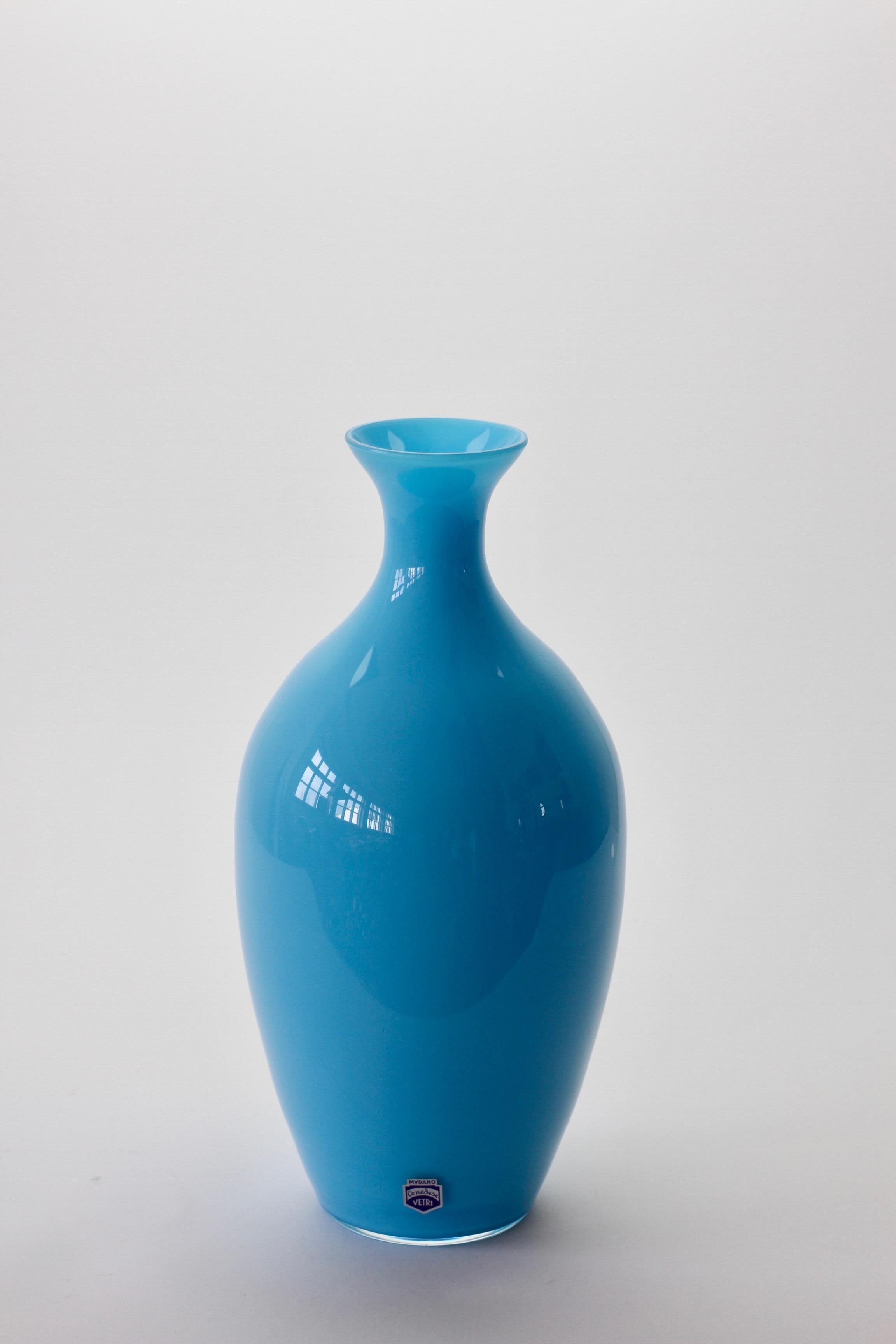 Wonderful light blue vase by Cenedese Vetri of Murano, Italy. A fun, funky and bright way to add a touch of bold color / color to your interior - imagine glass like this on open, white shelving in a kitchen, bathroom or in a display cabinet.

  