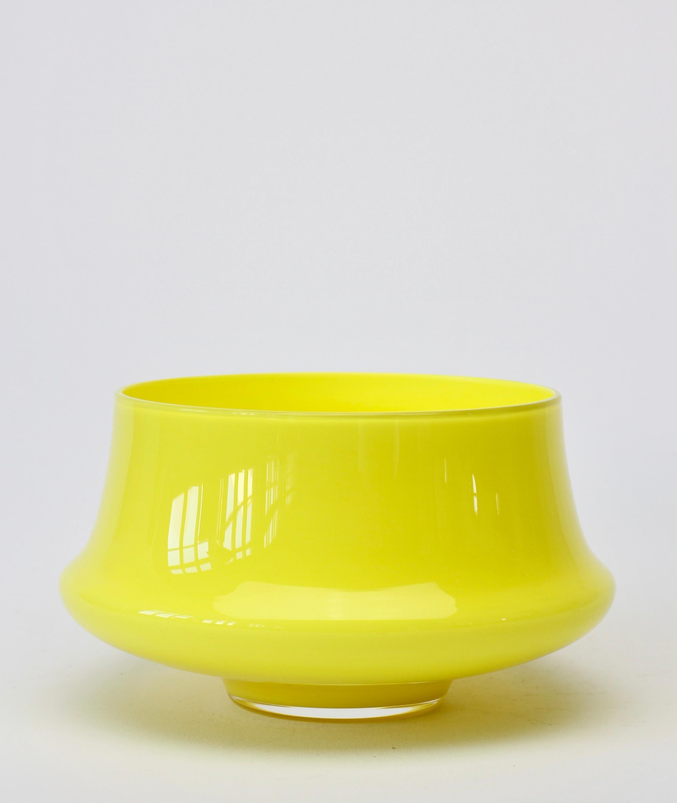 Midcentury vintage Cenedese Vetri of Murano, Italy. Particularly striking is the vessel's elegant form and bright yellow color (colour). Yellow is one of the hardest colors of glass to produce and, therefore, one of the rarest.

 

 