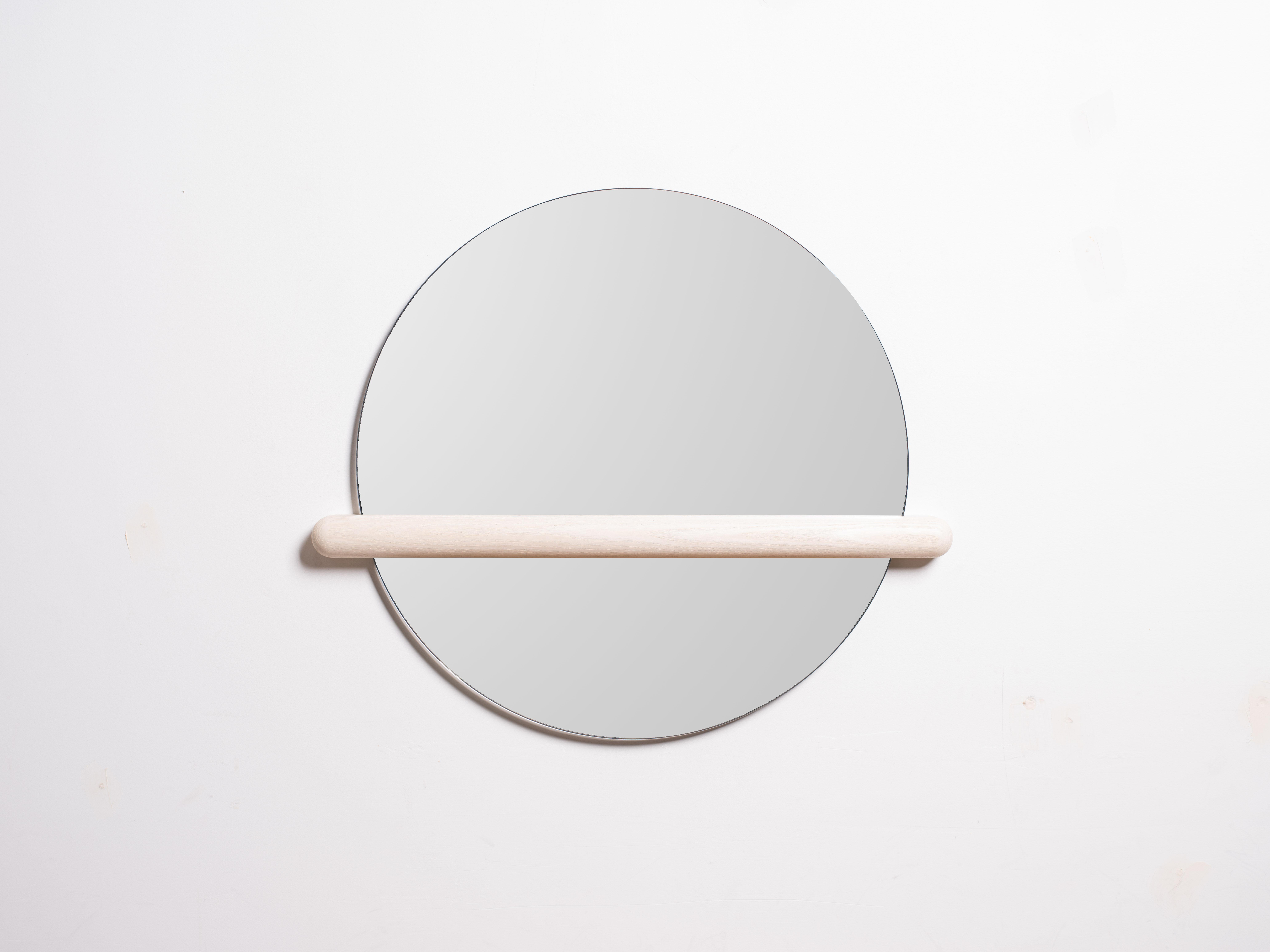 Mirrors are for reflecting but sometimes it's best we don't see the whole picture. Censor mirror intentionally obstructs your reflection to have a new perspective on your image. Easily mounted to the wall with two screws. Mirror slips in and out the