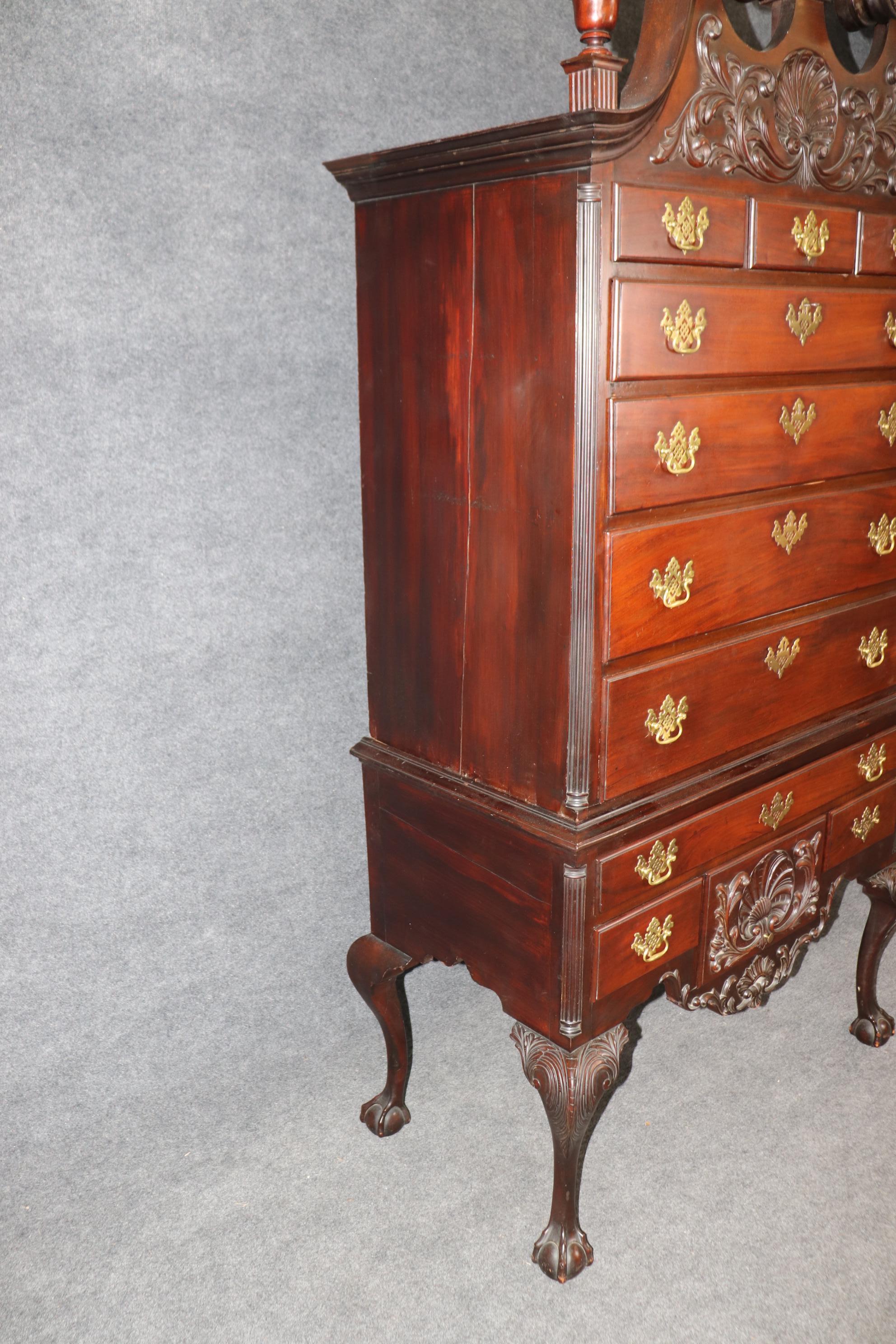 A spectacular Georgian design highboy or chest on chest was hand carved about 1876, celebrating the 
