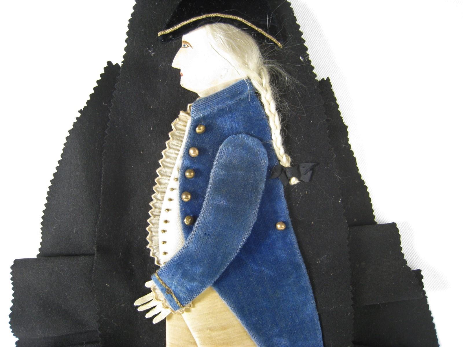 Wonderful centennial antique pen wipe made in the form of George Washington. Skilfully handmade of fabrics, tiny buttons, beads, leather, paper and human hair. The face is hand painted on paper, hair is braided human hair tied with a black silk
