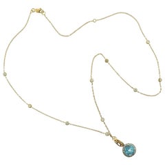 Center Blue Topaz and Diamond in 18 Karat Yellow Gold Halo Pendant Necklace