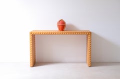 Center console covered with diamond-cut wood tiles.