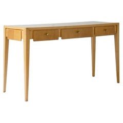 Center console table in blond maple in the style of Gio Ponti.