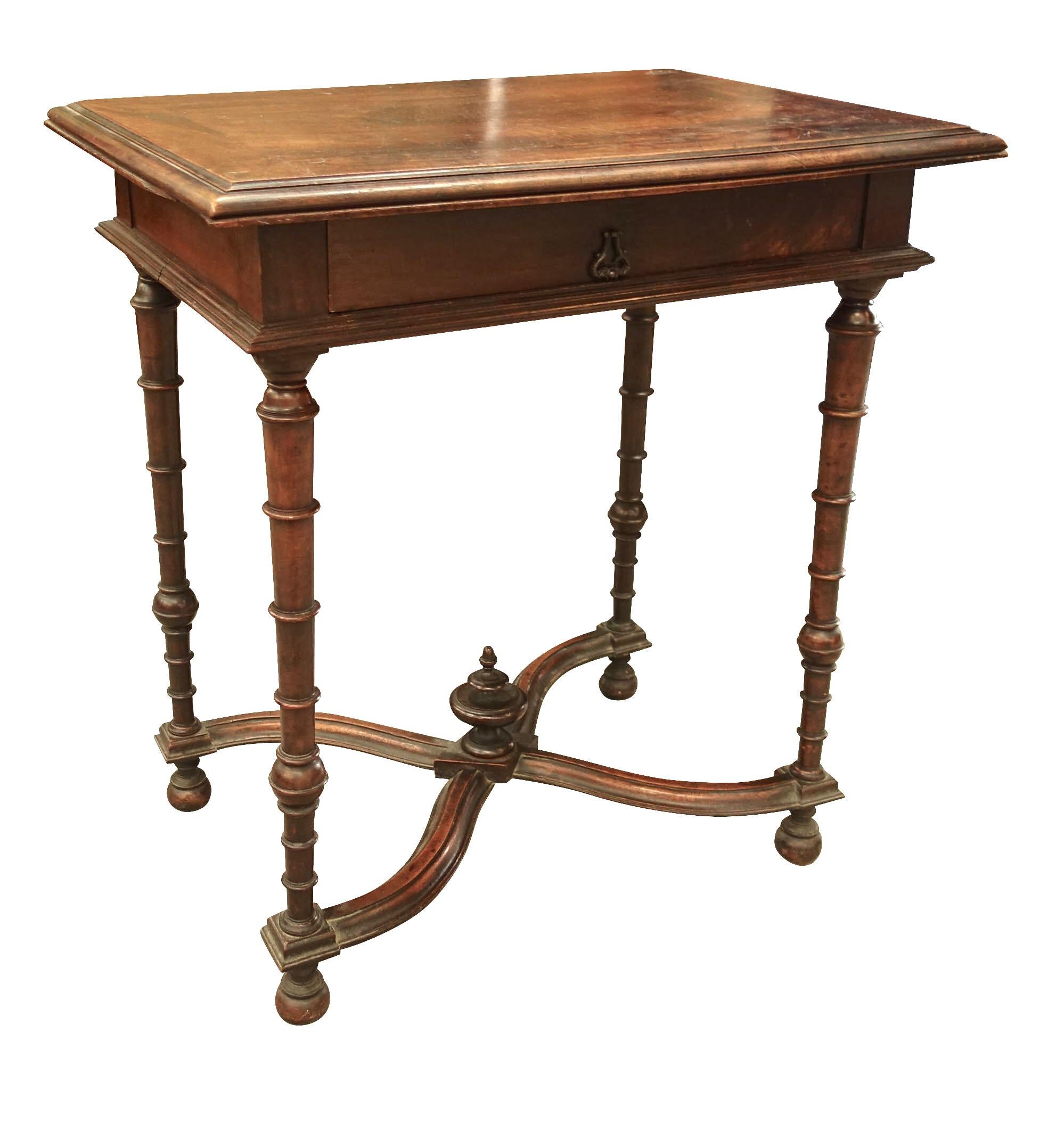 19th century French walnut side table with single center drawer
Legs have graded ring decorative detailing
Traditional X stretcher.