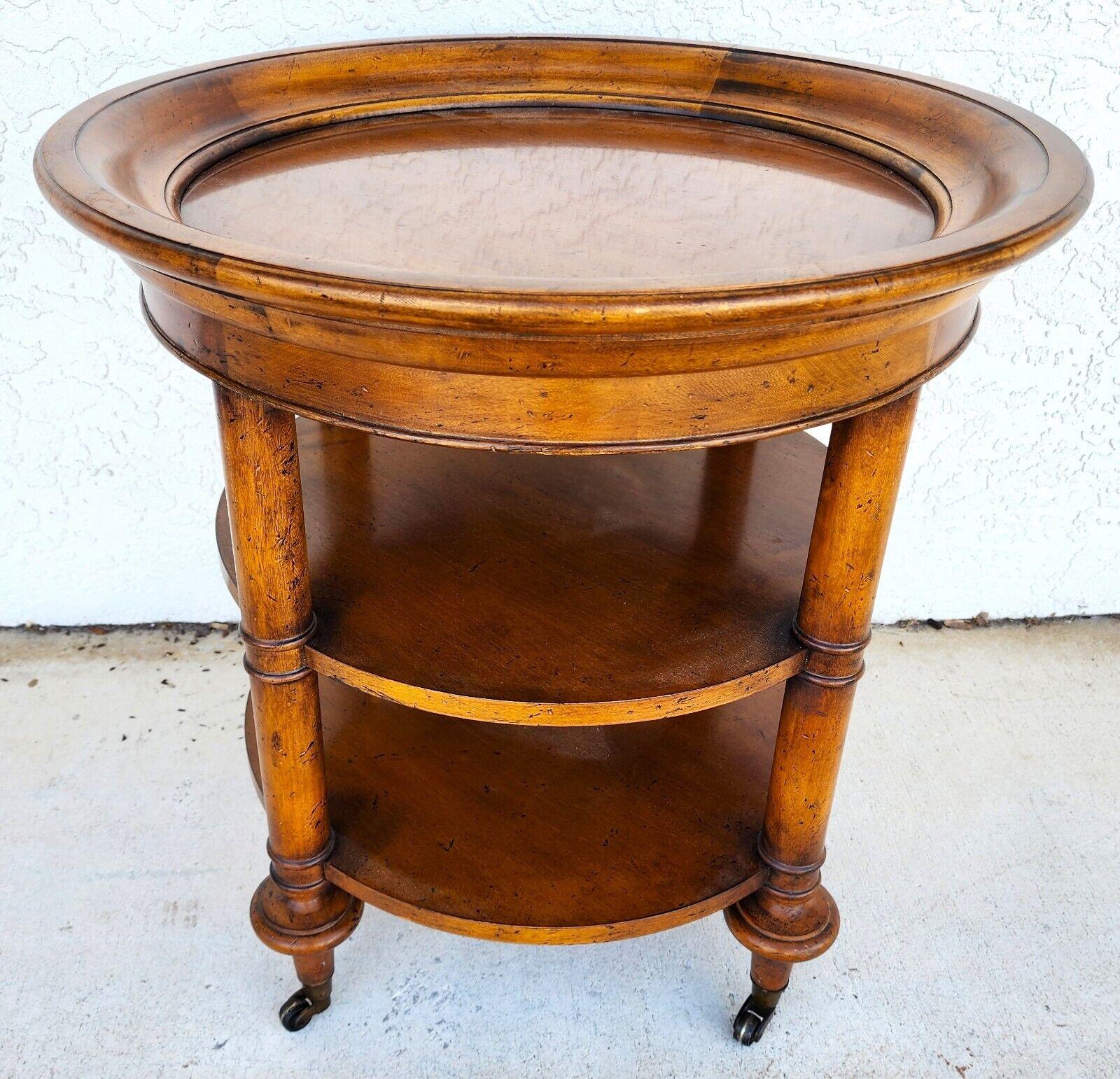 For FULL item description click on CONTINUE READING at the bottom of this page.

Offering One Of Our Recent Palm Beach Estate Fine Furniture Acquisitions Of A
Center End Side Occasional Table 3-Tier in Solid Distressed Fruitwood by BAKER
Very