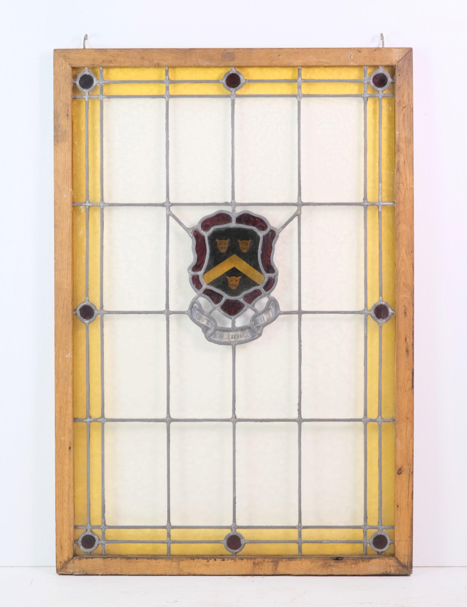 Center Lion Head Crest Stained Glass Window with Red Jewels and Yellow Border In Good Condition In New York, NY