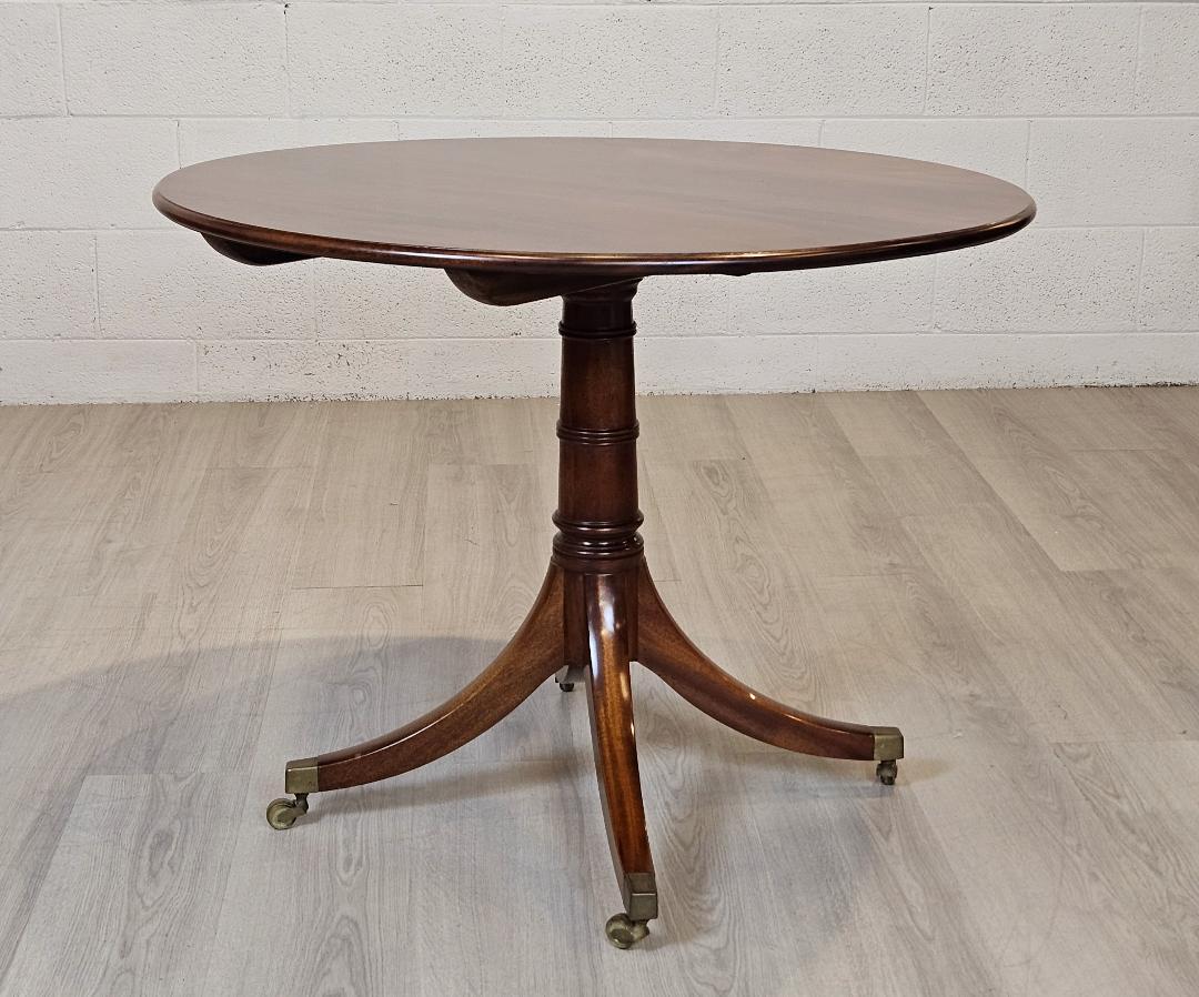 Center or Games Table Eighteen Century Style Single Pedestal Brass Toe Caps
Embrace the warmth of traditional charm and functionality with our exquisite English tilt-top 36