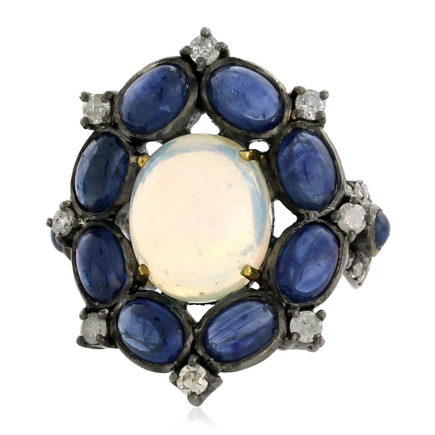 Center Stone Opal Ring Surrounded by Blue Sapphires & Diamonds Made in 18k Gold In New Condition For Sale In New York, NY