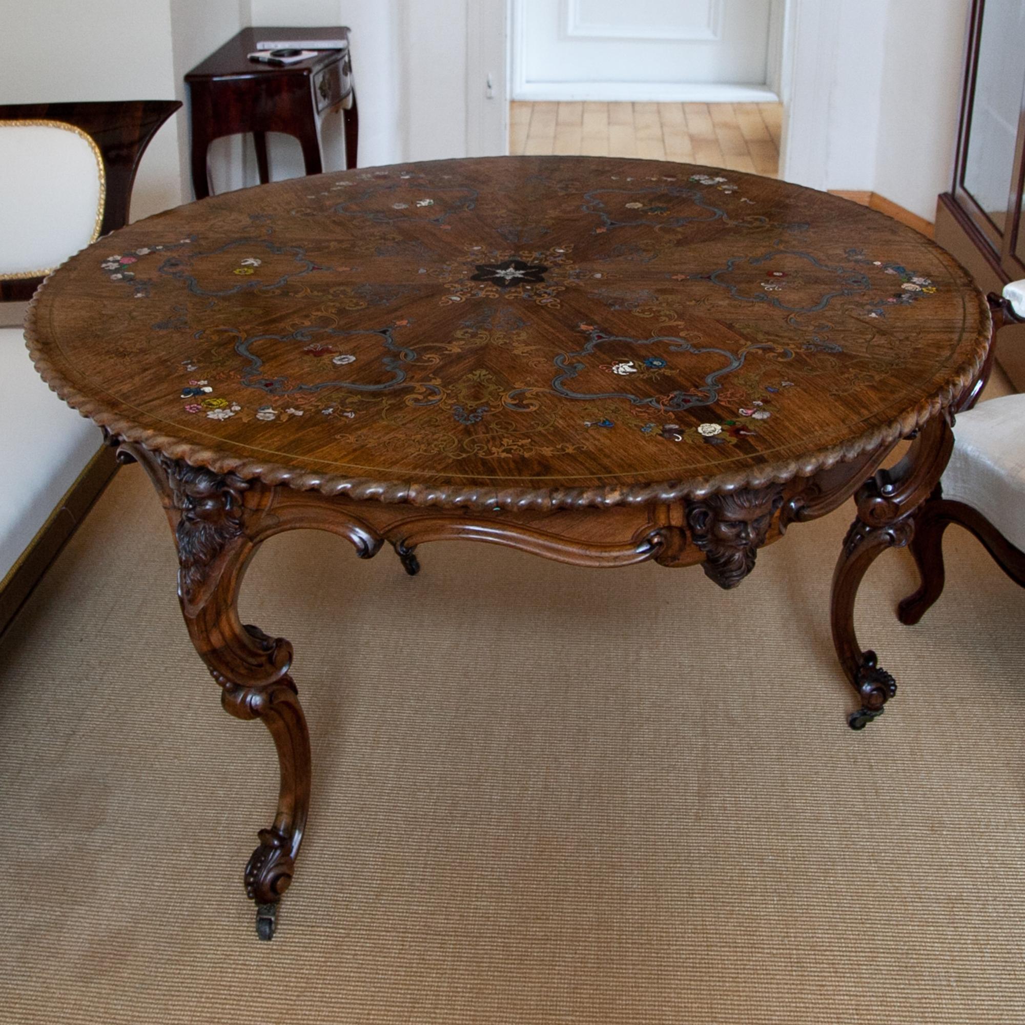 Large centre table by the famous Bavarian cabinetmaker Franz Xaver Fortner (1798-1877, Munich) from circa 1840. The tabletop shows a rich inlay work out of brass, copper, tin, mother of pearl and partly colorized lacquer inlays display flowers,