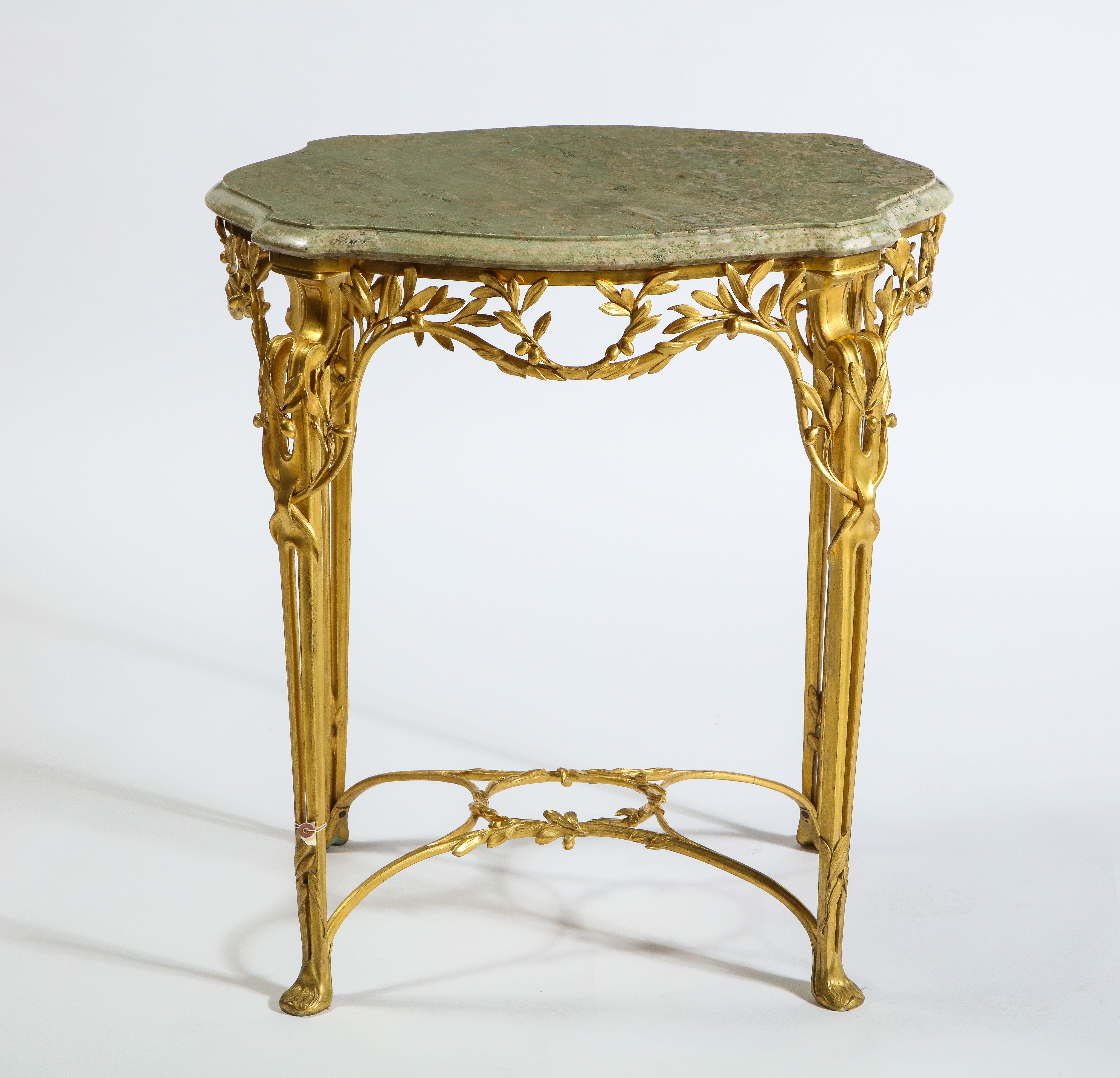 A very unusual and quite exquisite dore bronze and marble-top center table/side table, signed Tiffany & Co., attributed to Louis Comfort Tiffany. This table is exquisitely made by the famous Tiffany & Co., most likely designed by Louis Comfort