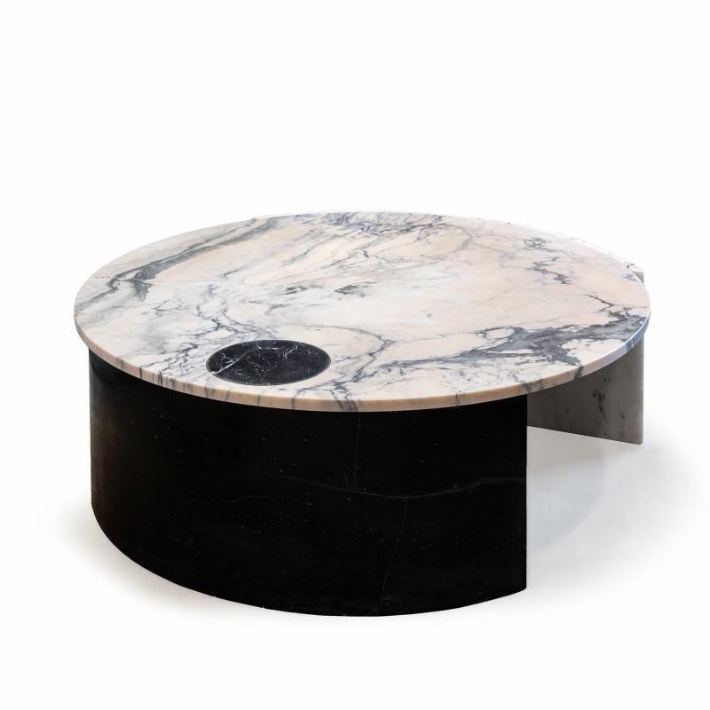 Helene center table is unique in its conception. The combination of different marbles like Estremoz marble, Nero Marquina and Estremoz pink marble makes this piece a sign of unconformity and originality. Made to Order. 
