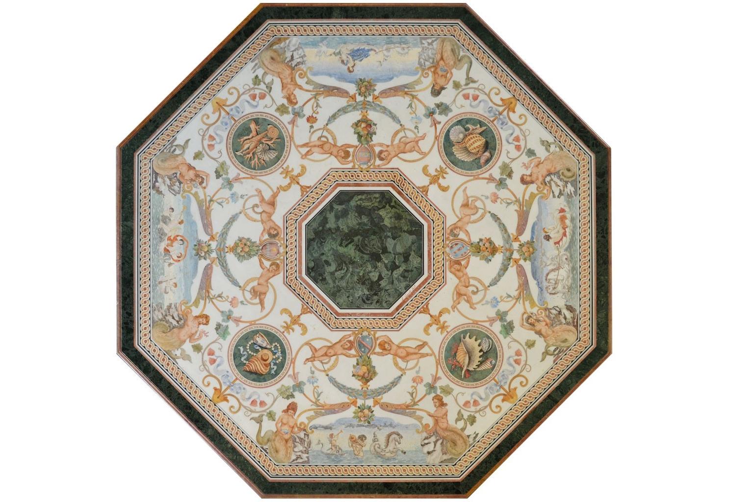 Grande tavolo in marmo con piano intarsiato e base in legno intagliato, realizzato a mano in Italia da Bigli.

Il tavolo ottagonale Angelica rappresenta uno dei capolavori di Cupioli. L'imponente dimensione del piano di cm. 210 x 210 e la ricchezza