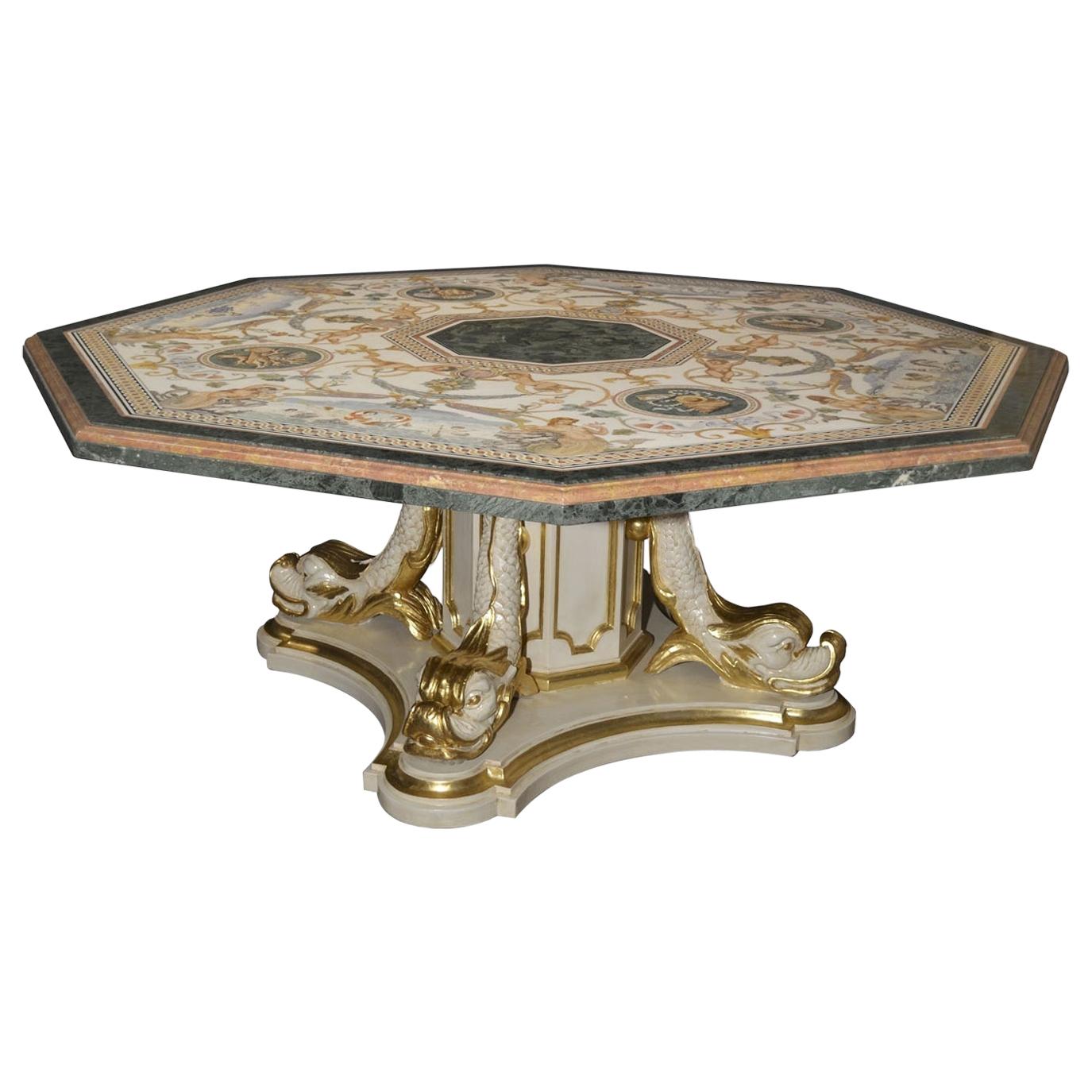 Octagonal table represents one of the Cupioli masterpieces. The imposing dimension of the top cm. 210 x 210 and the wealth of 3 prestigious marbles as pure white, royal yellow and green guatemala are a perfect background for such an important