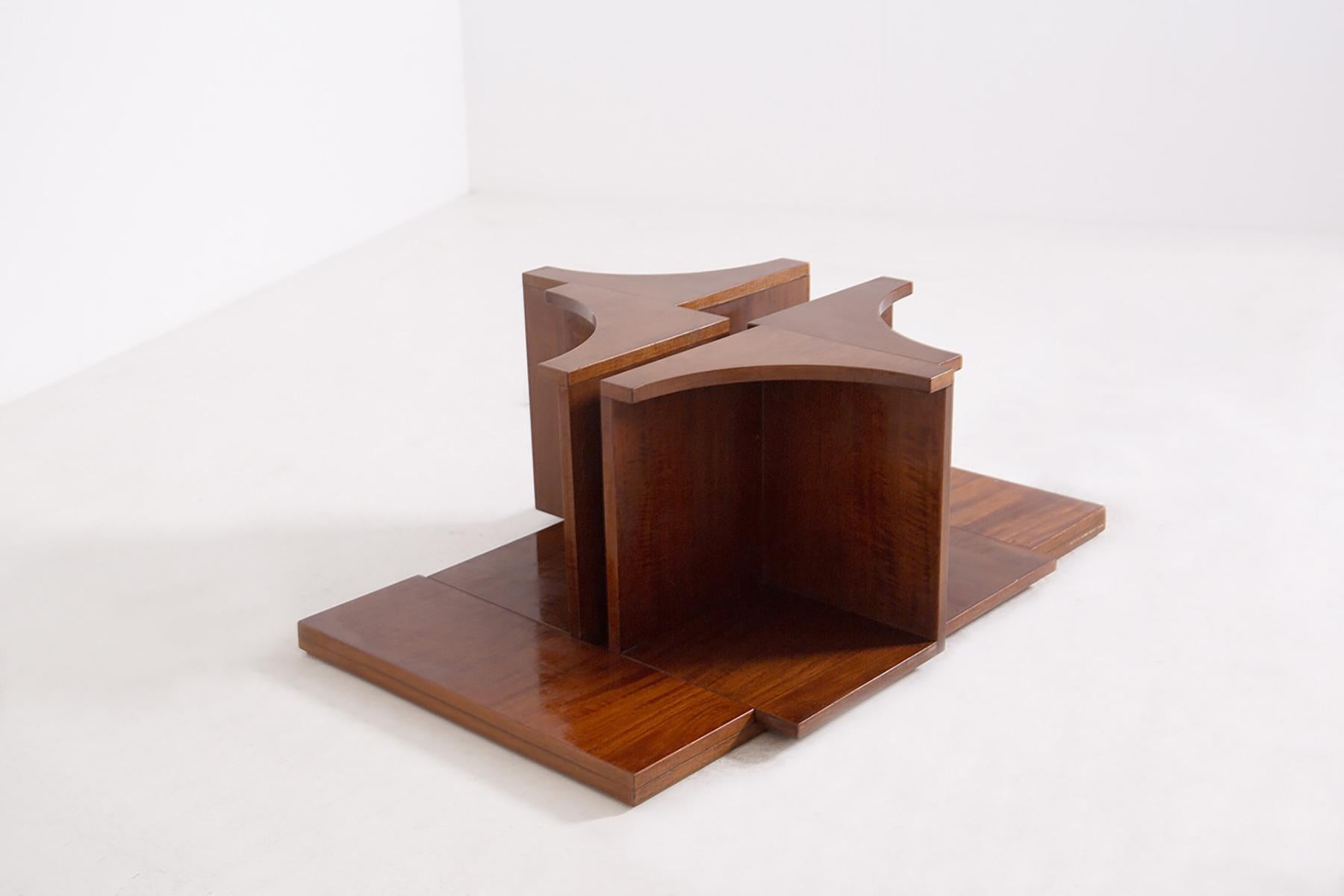 Very rare modular center table by Tytti Laurola made by Tonelli Broggi Cantù in 1967.
The center table is composed of four identical modular blocks in wood. The glass is original of the time.
The peculiarity of the center table is definitely its