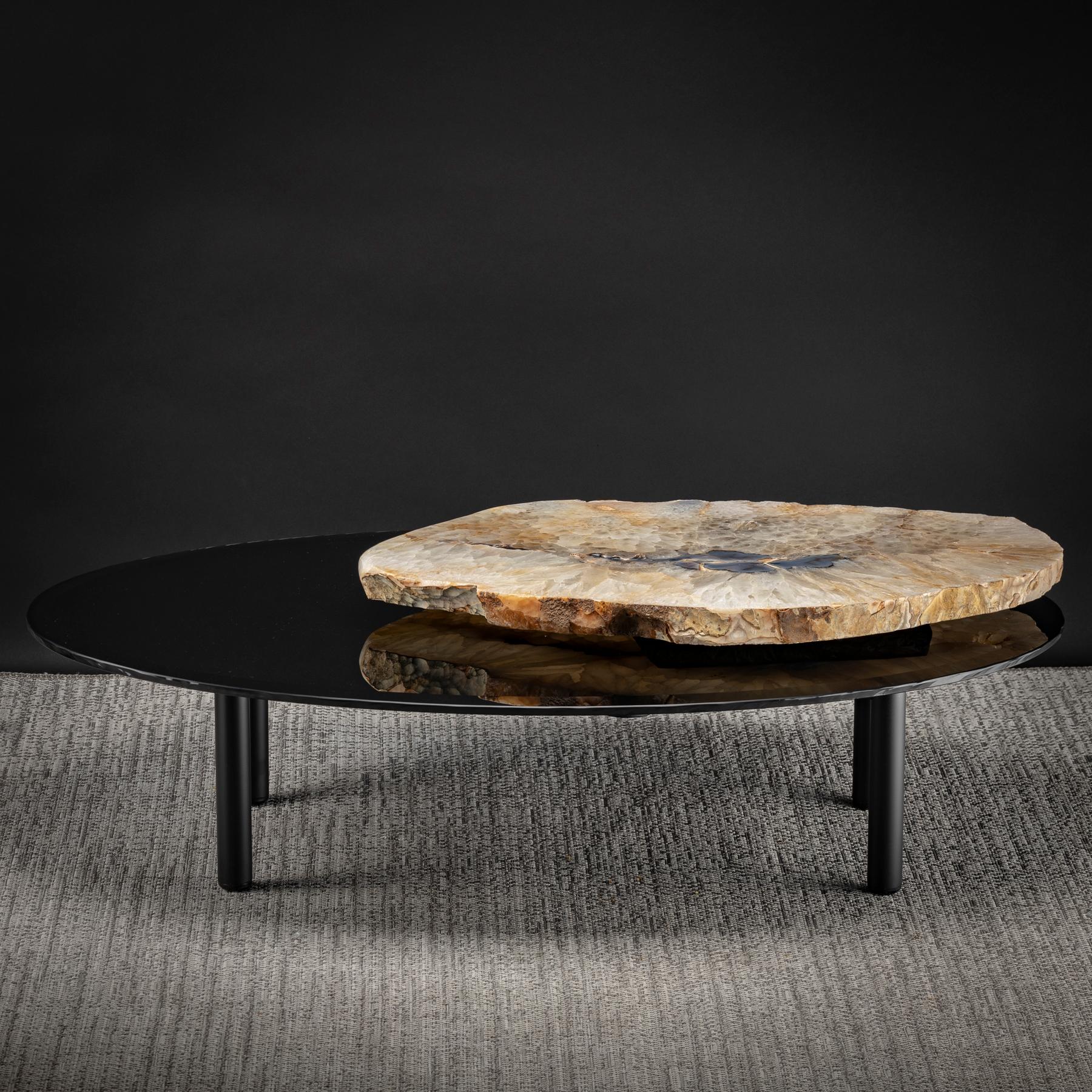 This center table is an original design featuring a 3-way rotating Brazilian Agate.
Measures

Agates are formed in rounded nodules, which are sliced open to bring out the internal pattern hidden in the stone. Their formation is commonly from
