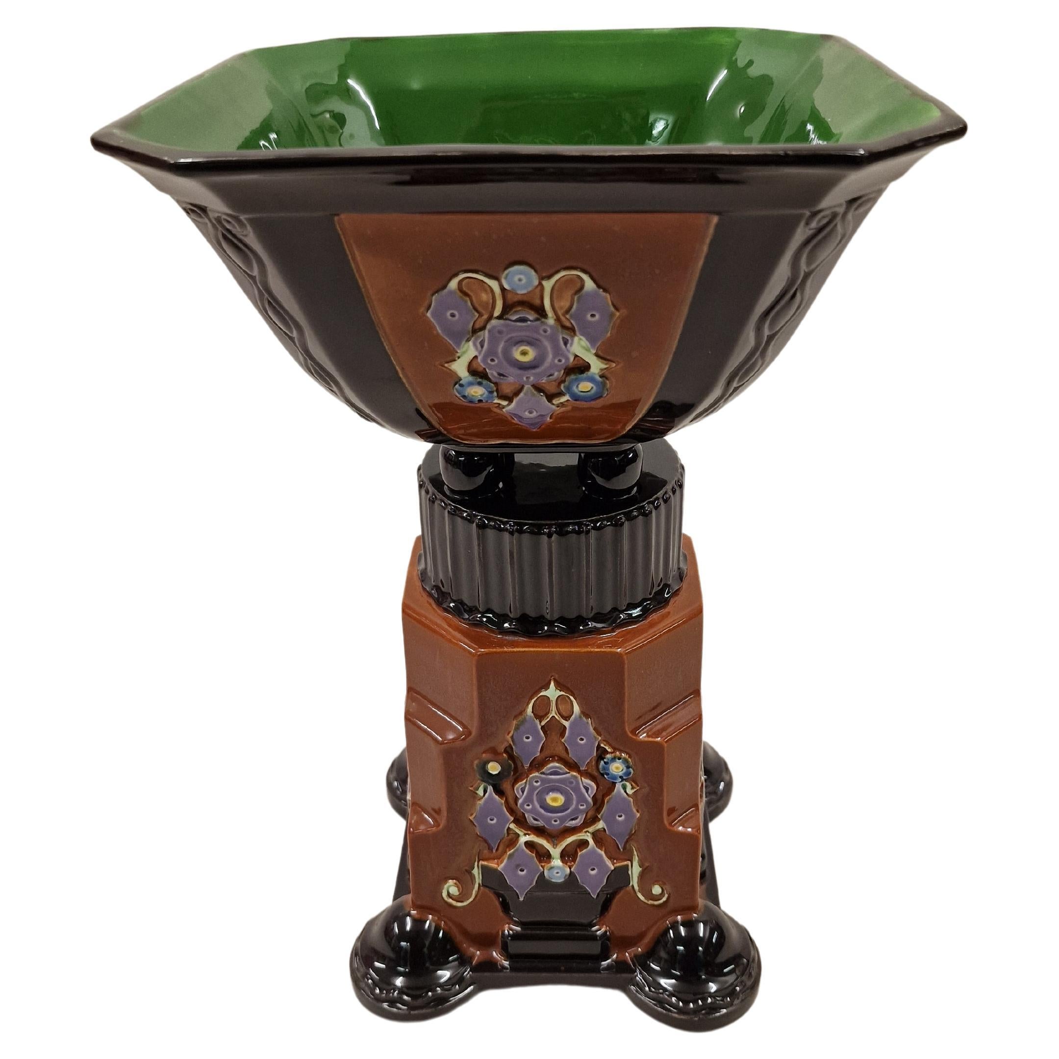 Huge pure Art Deco Centerpiece from the famous manufacturer Eichwald. 
This exceptional piece is an example of pure art deco art. 
The structure consists of a square base with rounded edges, this base is decorated on all four sides with stylized