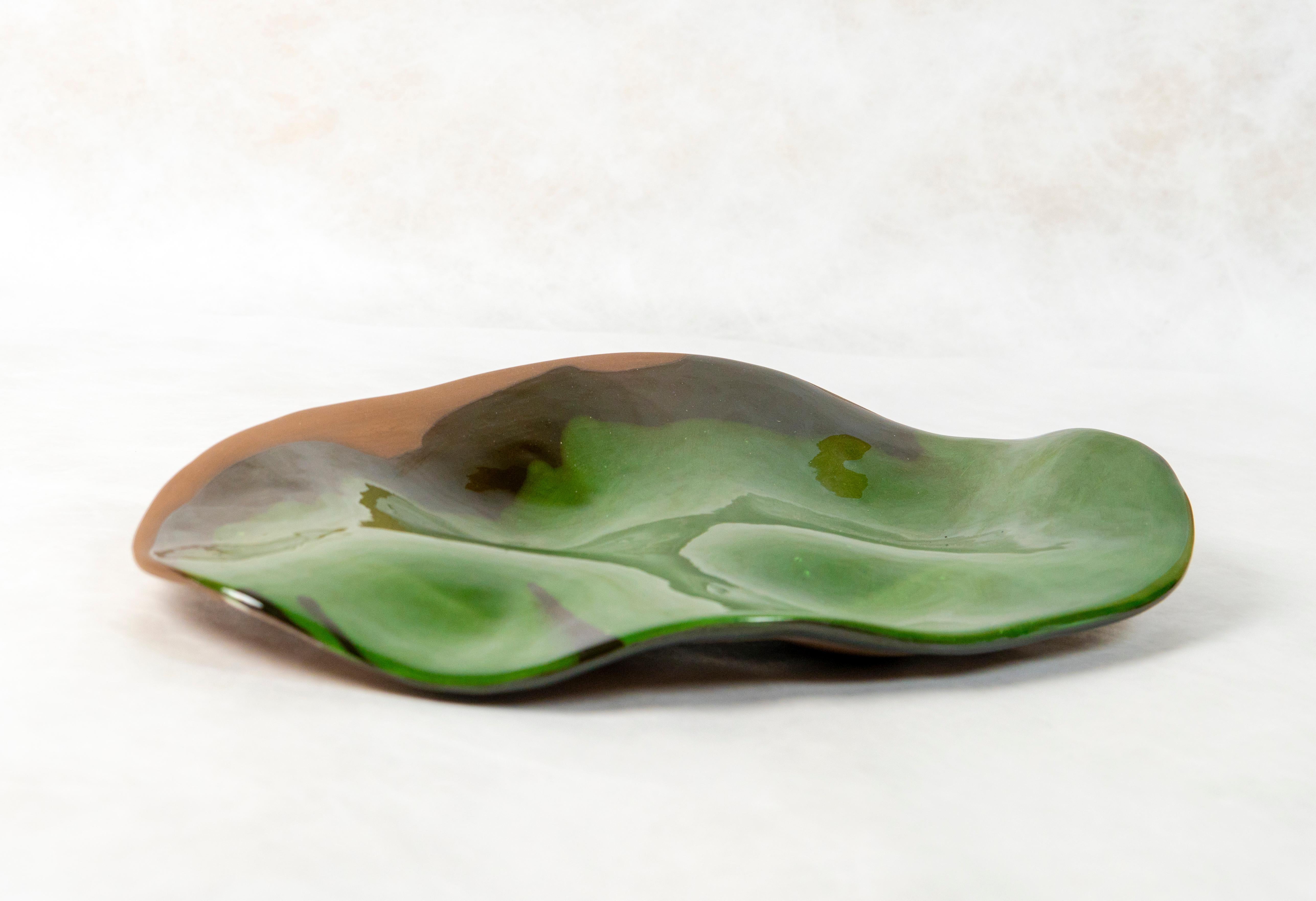 A unique centerpiece ceramic by Claire de Lavallée.

Landscape earthenware with green glaze.