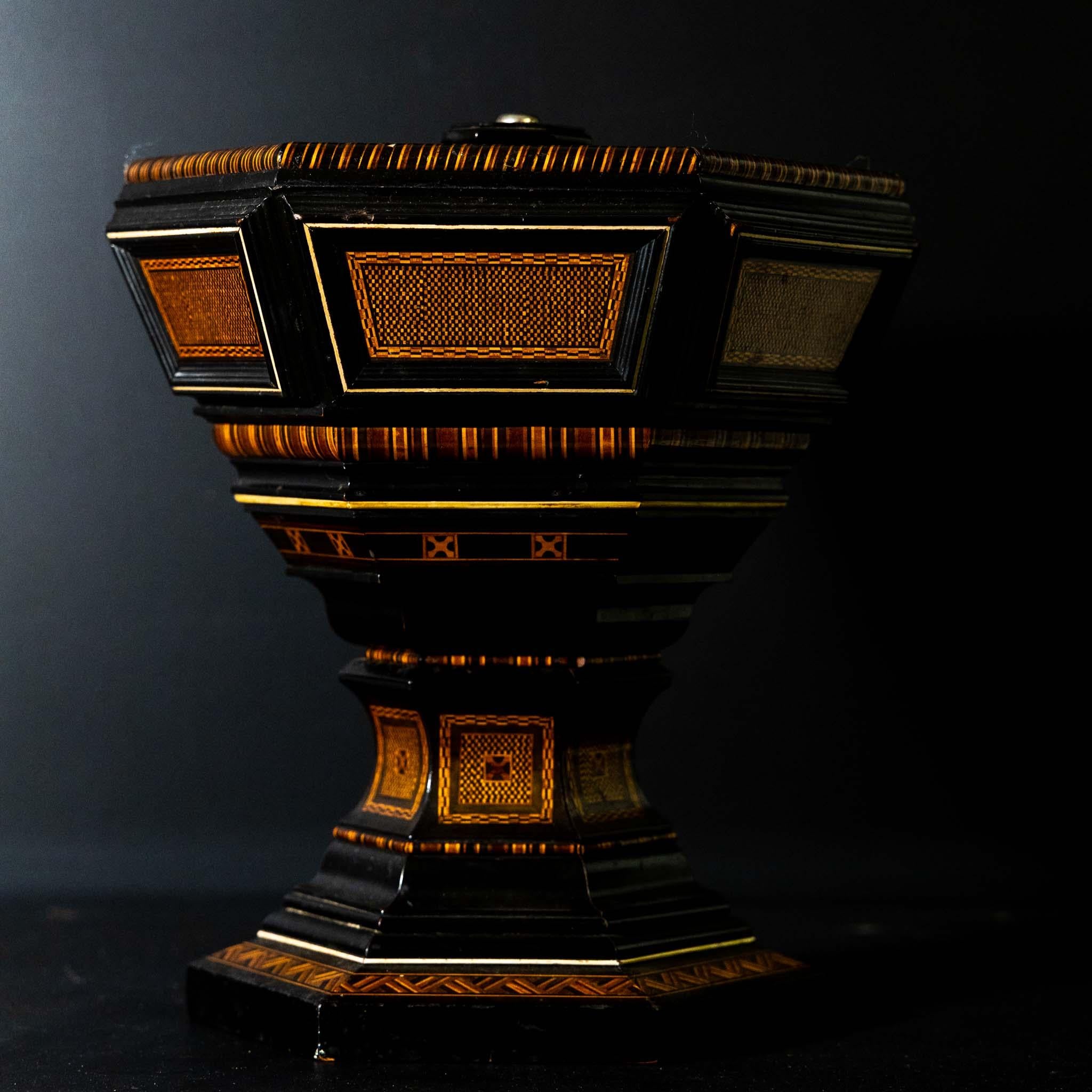 Centerpiece with hexagonal bowl and profiled base and inlayed surface.