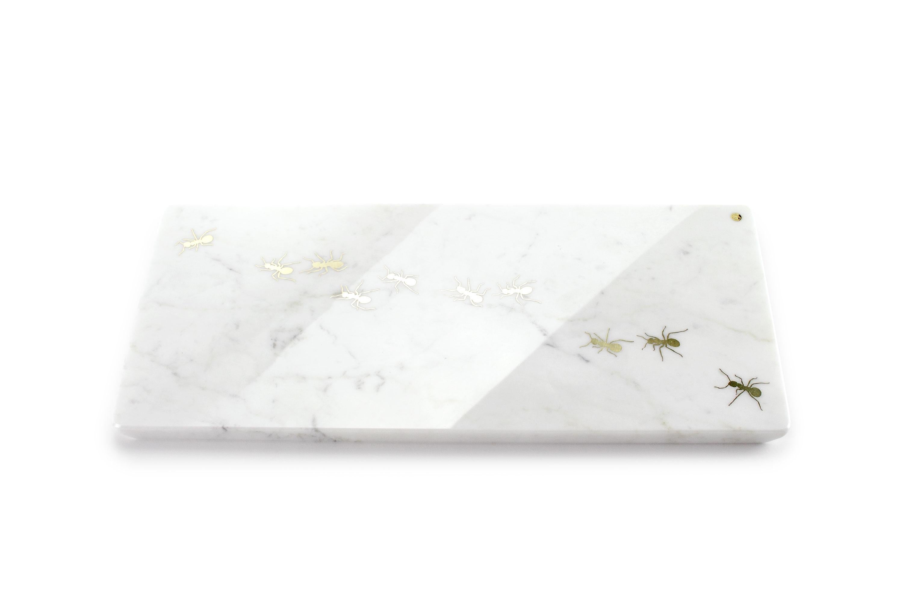 Centerpiece / Serving plate in white Carrara marble with polished brass inlay.

Dimensions: Big - L 45 W 20.5 H 1.5 cm
Also available: Medium - L 45 W 12 H 1.5 cm or Small - L 26 W 11 H 1.5 cm

100% Hand made in Italy. 

Marble is a natural