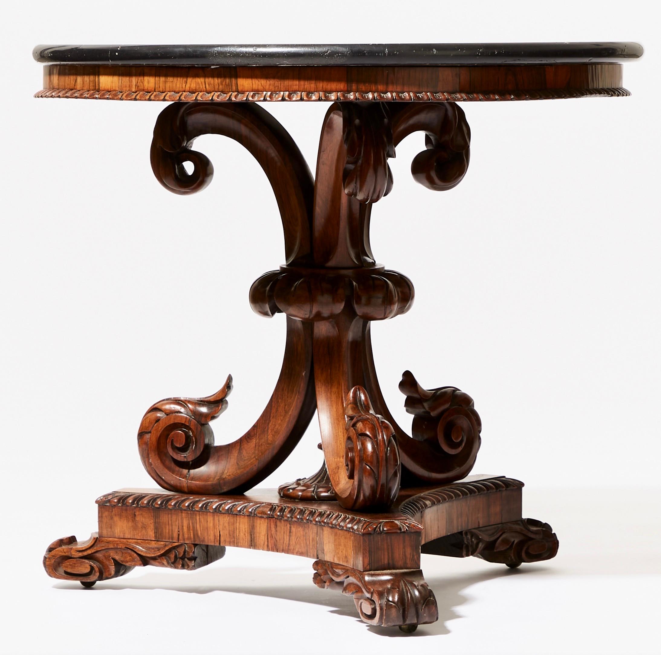 A center-table made around 1840. The base is veneered with rosewood and probably English. The top is made in scagliola technique by the Della Valle Brothers in Italy. The top has a beautiful motive of a nature-schene with waterfalls.