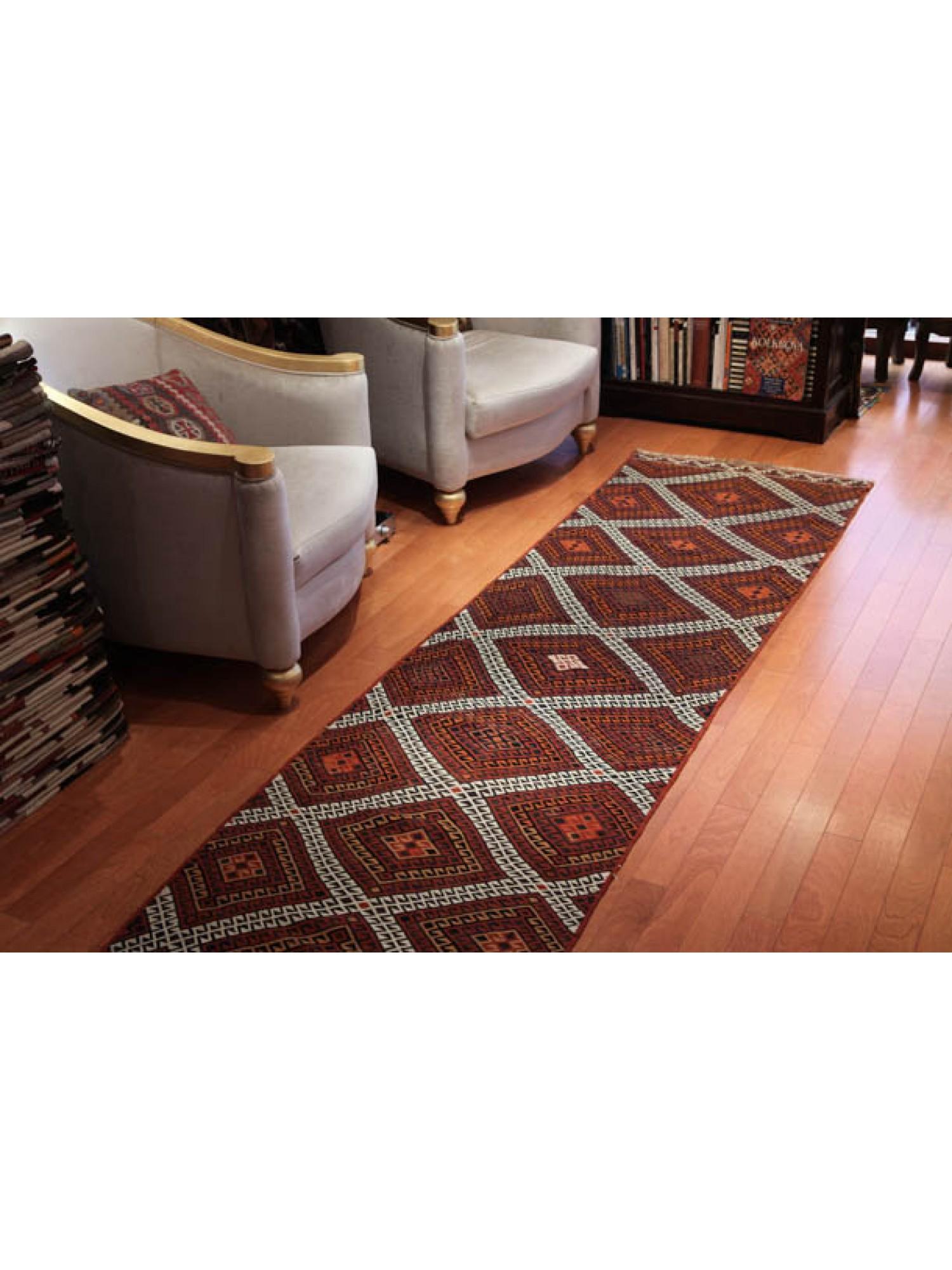 This is Central Anatolian Vintage with a rare and beautiful color composition. 

It is a long and thin runner that reaches up to three meters. What is amazing is the intricately woven intricate patterns all over the surface. It is clear at a glance