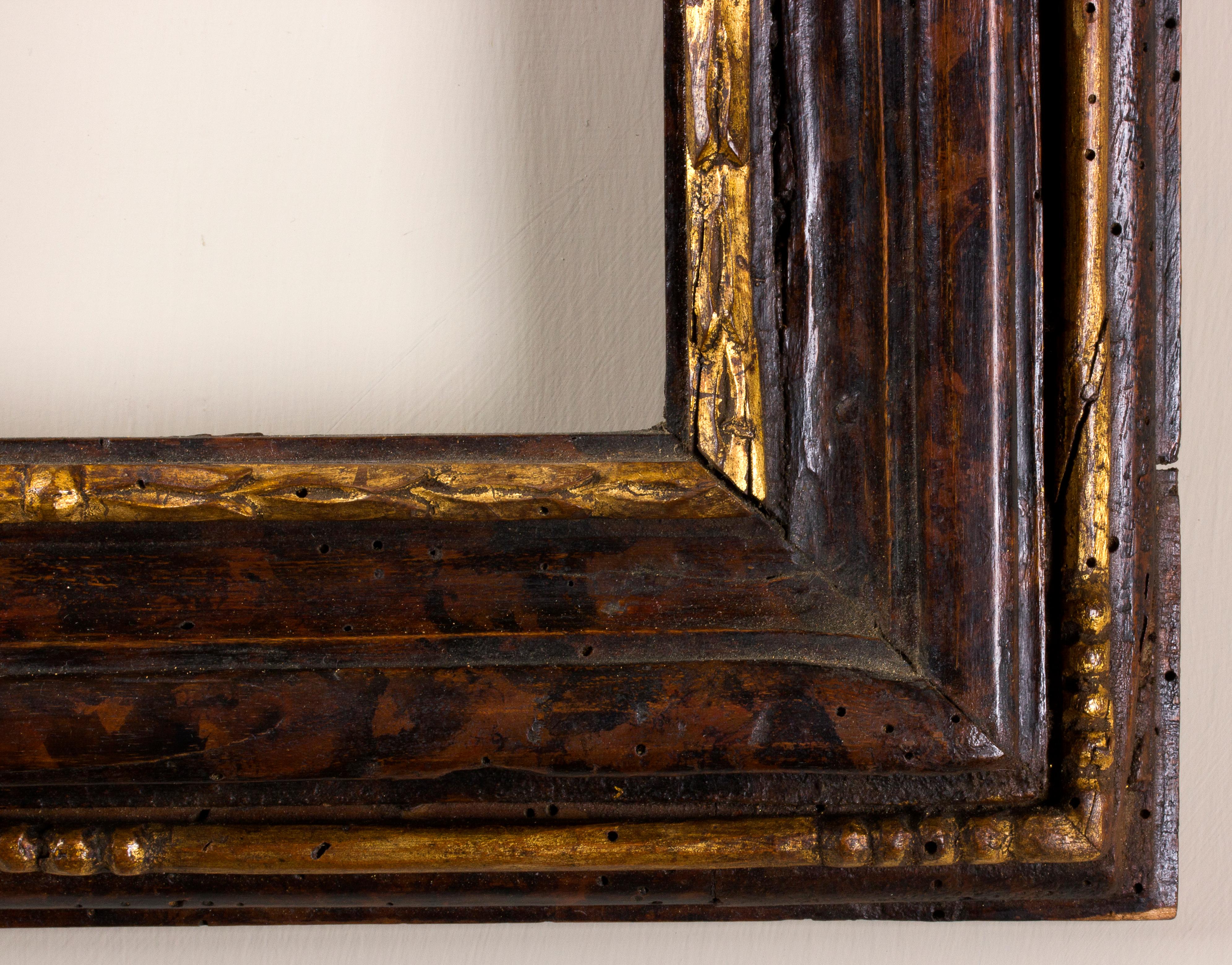 Central And Northern Italy frame, 18th century
Golden and faux-tortoiseshell painted wood decorated with recurring leaves motif.
Measures: Inside 27 x 21 cm; outside: 42 x 36.5 cm
Depth is the wide of the band.
 