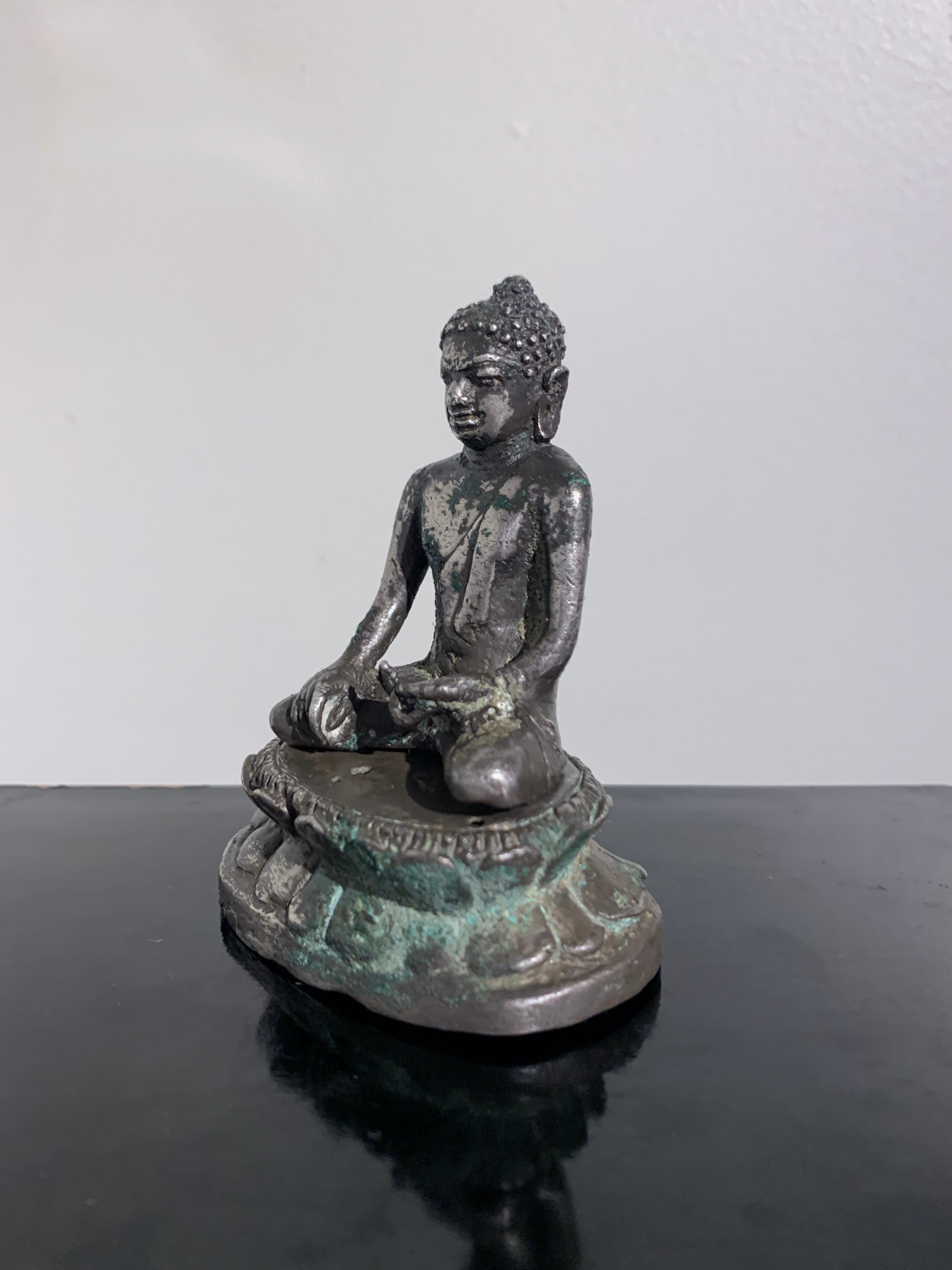 Central Javanese Cast Silver Transcendent Buddha, 9th-12th Century, Indonesia In Good Condition For Sale In Austin, TX