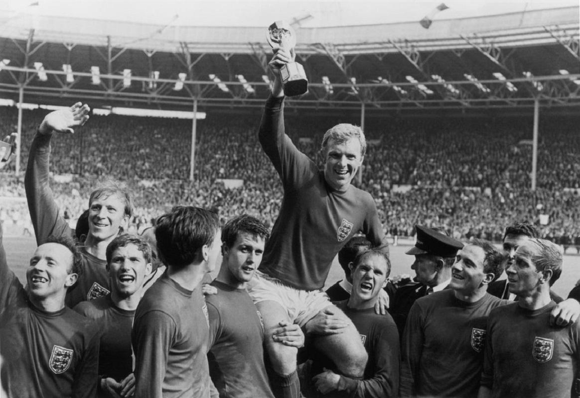 "World Cup Victory" by Central Press

England captain Bobby Moore (1941 - 1993) holds up the Jules Rimet trophy as he is carried on the shoulders of his team-mates after their 4-2 victory over West Germany in the World Cup Final at Wembley Stadium.