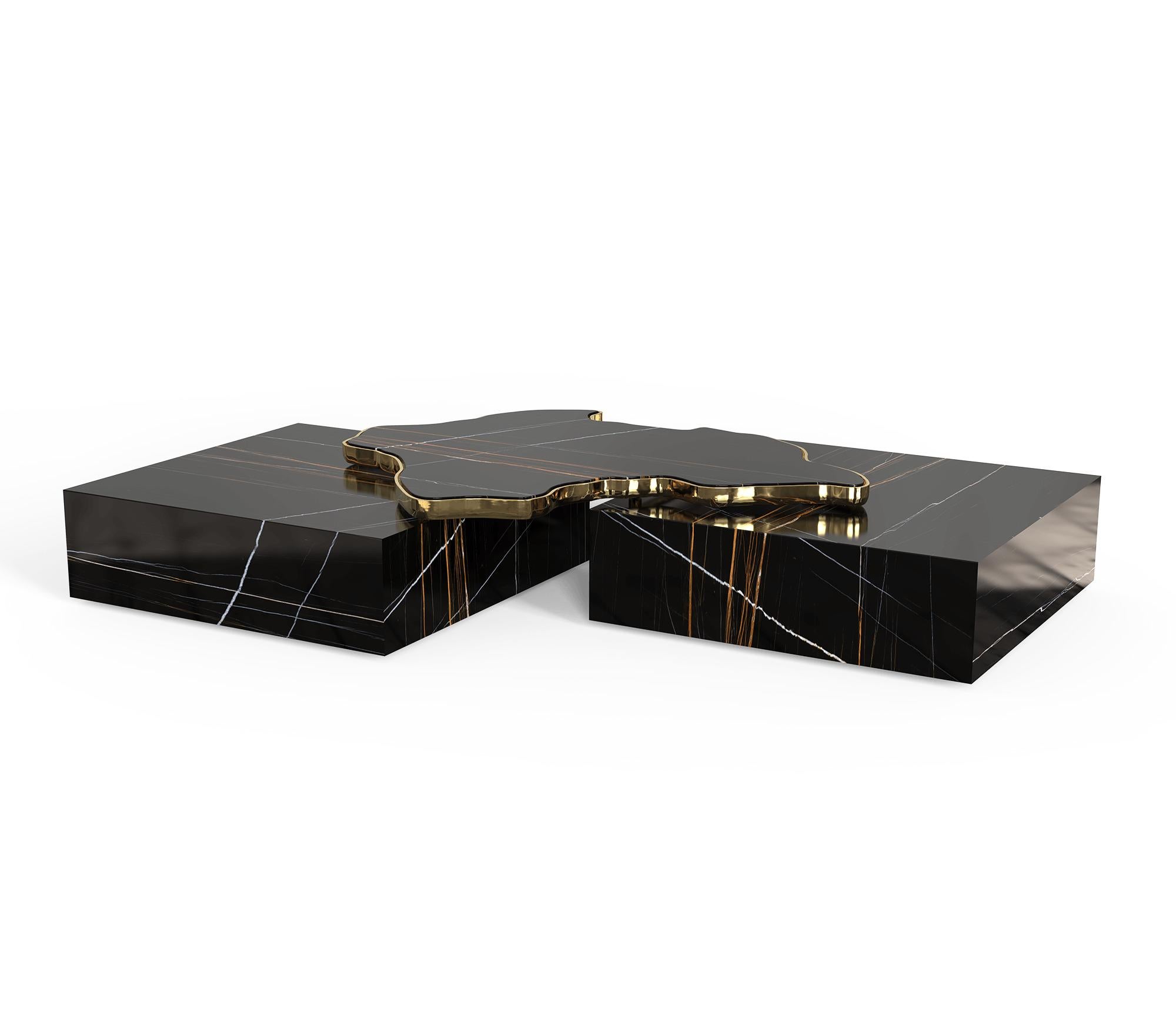 Centre table in black marble

A contemporary center table composed by two square marble modules, linked by an organic marble surface element on top enveloped by casted brass.

Dimensions: H: 35 cm, l: 206 cm, d: 136 cm

Time of production 12