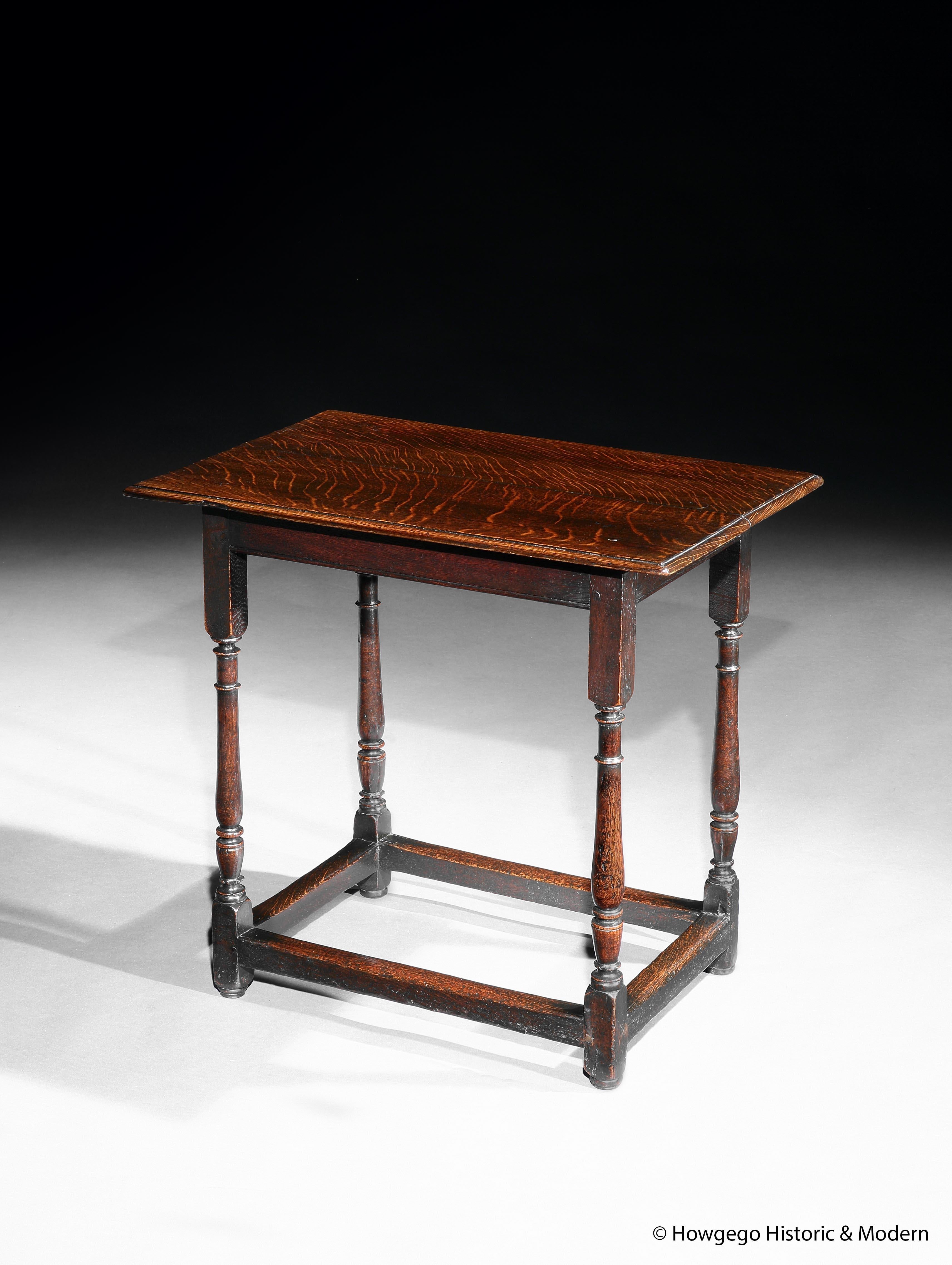 This elegant centre or sidetable is an unusual small size. 
It has a pared down form with no frieze drawer and would Stand well in a contemporary interior
The carpenter has used high quality quarter sawn oak with numerous medullary rays which he