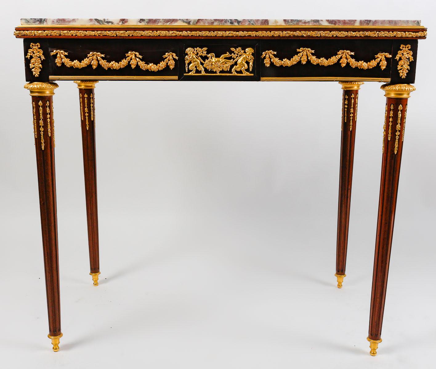 Centre table, small desk 19th century, Napoleon III period.

Centre table, small desk in the style of François Linke, 19th century work, Napoleon III period, gilt bronze and marble top, drawer in the waist.  

H: 76cm, W: 84cm, D: 51cm
