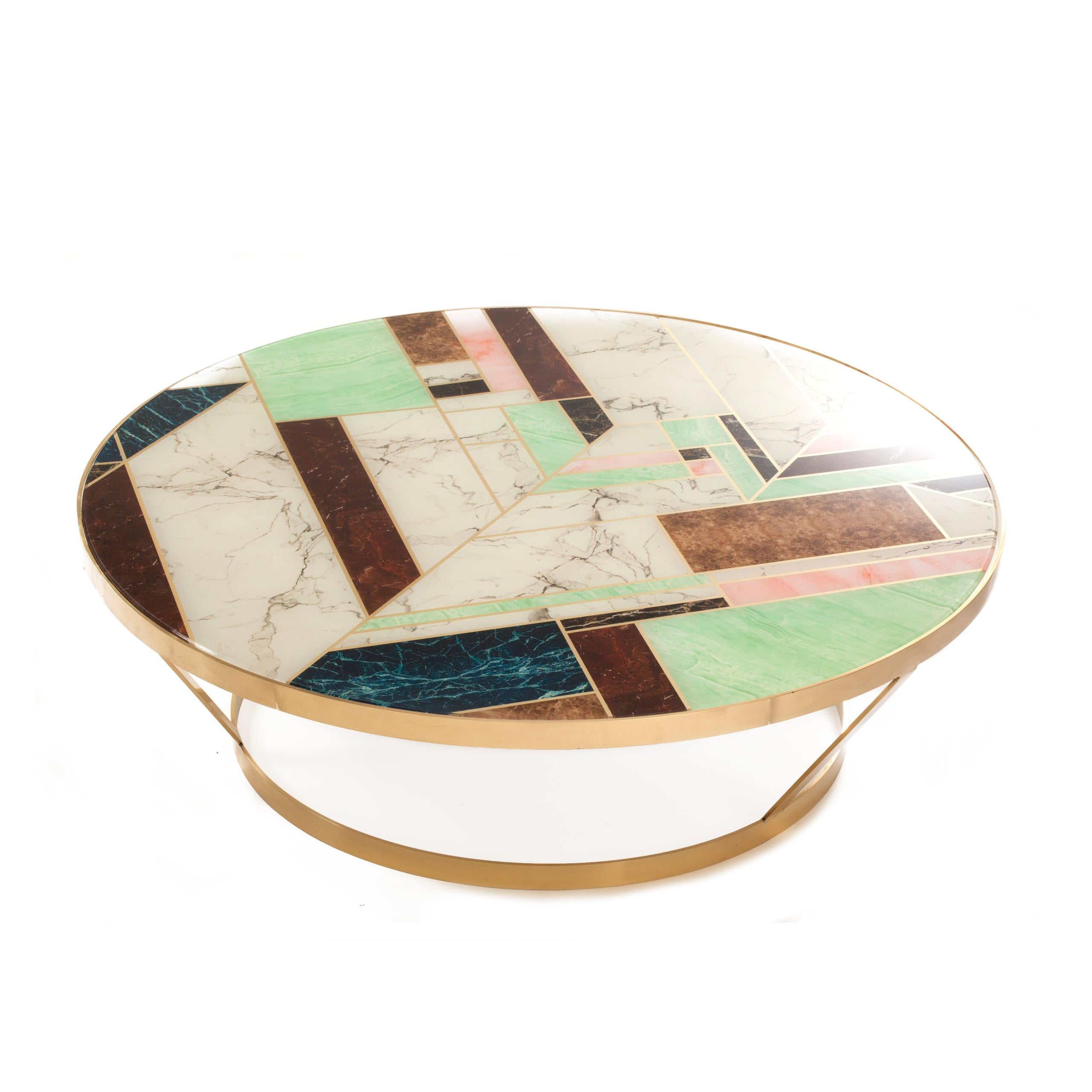 York brings a modern twist to traditional marble. A round top with bold, geometric pattern sits on a polished brass structure, making York a truly unique piece. Made to Order.
