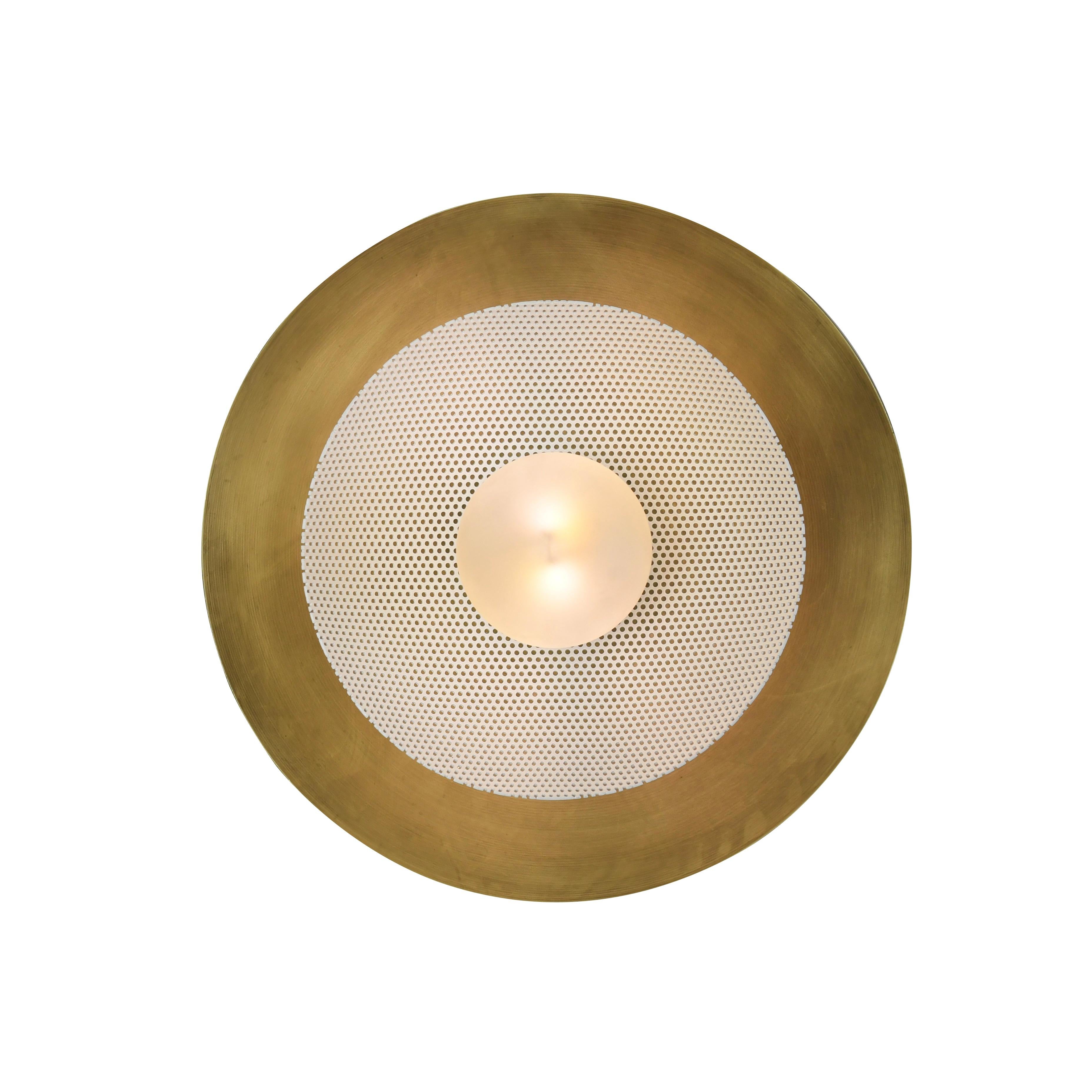 The Centric wall sconce is a stately take on French modernism, featuring a spun metal mesh shade nestled into a large solid brass bowl. Part of our Axial family of products, the Centric wall sconce is a substantial, handsome piece that works well in