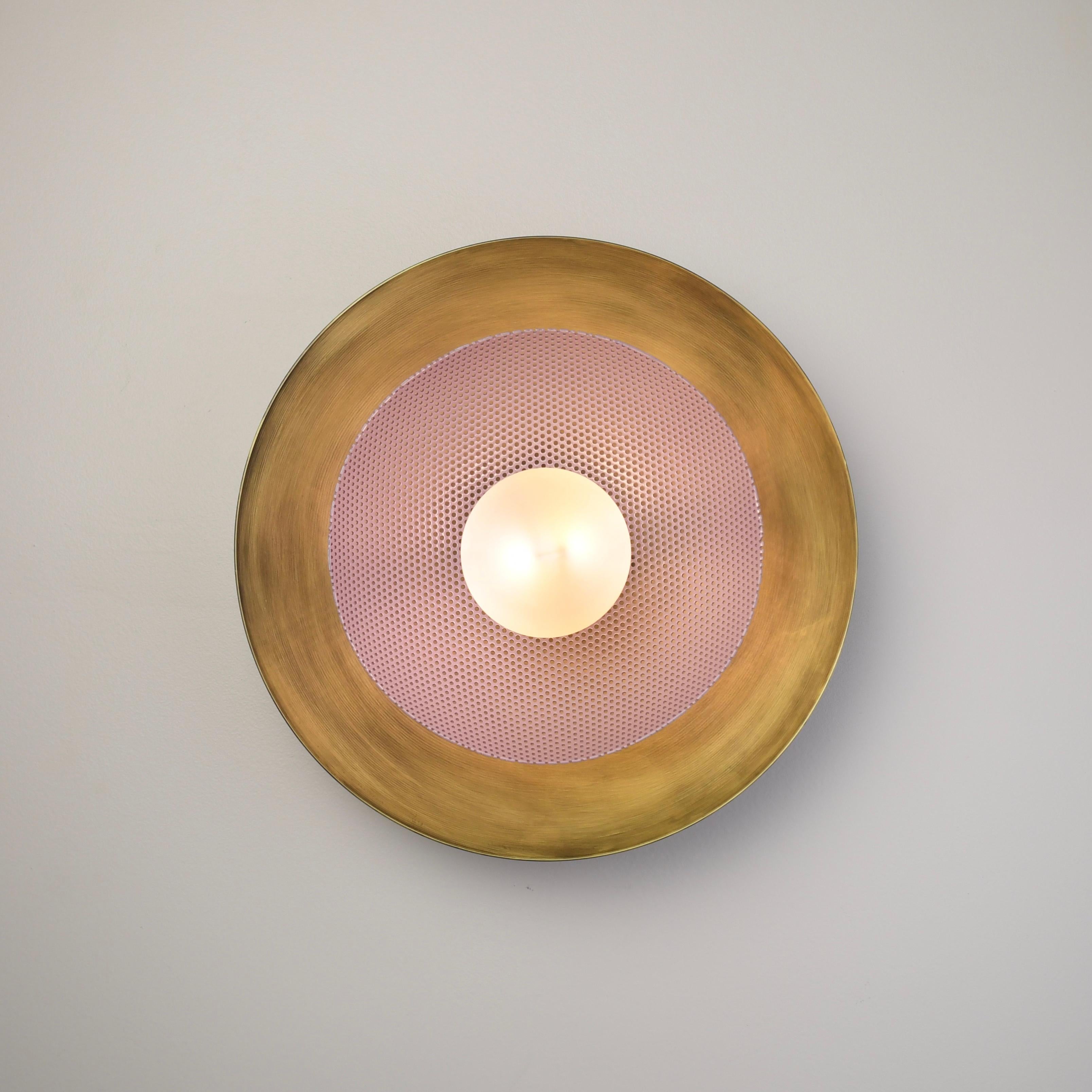 The Centric wall sconce is a stately take on French modernism, featuring a spun metal mesh shade nestled into a large solid brass bowl. Part of our Axial family of products, the Centric wall sconce is a substantial, handsome piece that works well in