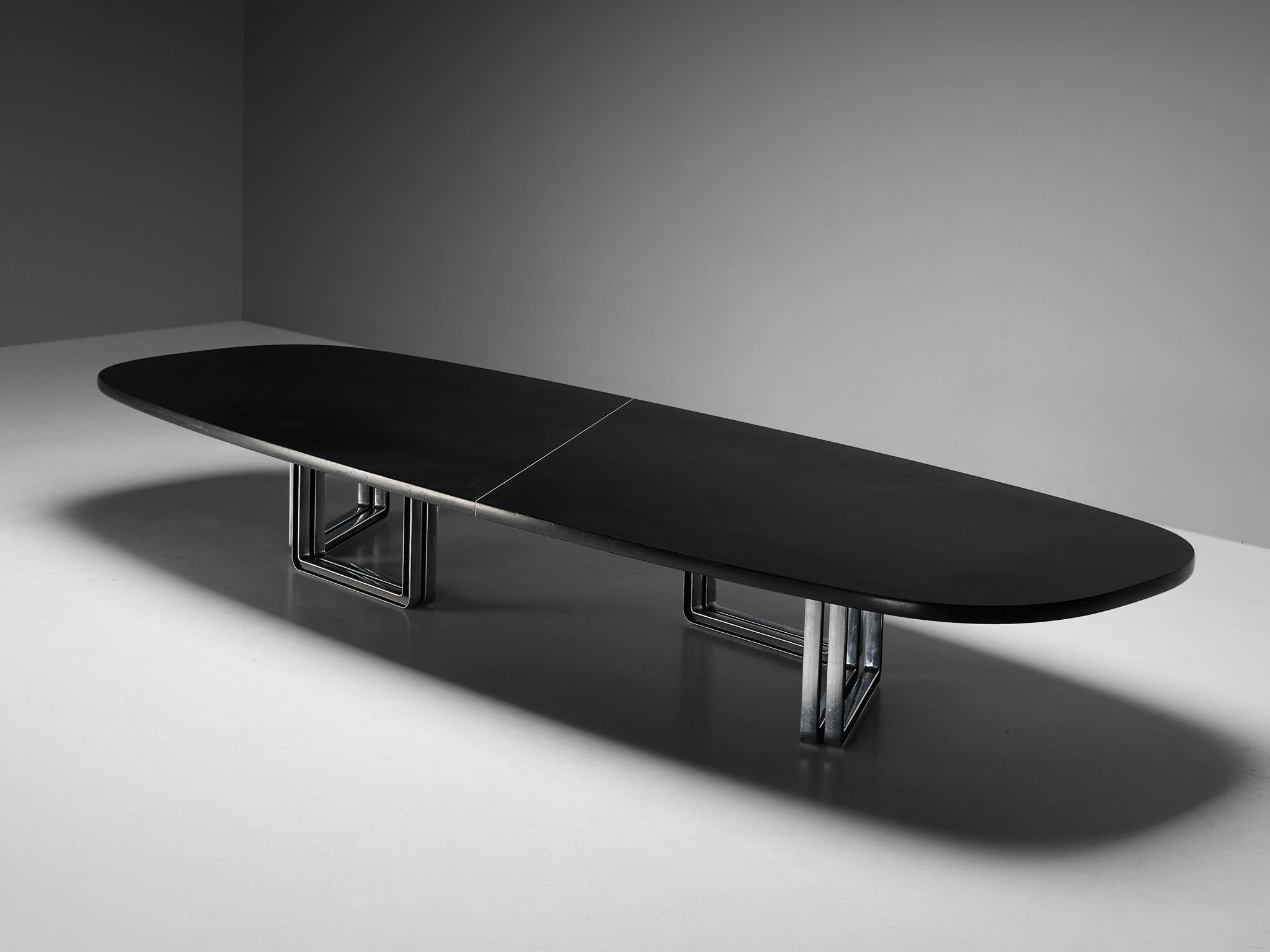 Centro Progetti Tecno, conference table model 'T335', lacquered wood, aluminum, Italy, 1975-1978

Large conference table with a black lacquered wooden top that has an incredibly soft texture. The table is composed of two parts that are visually