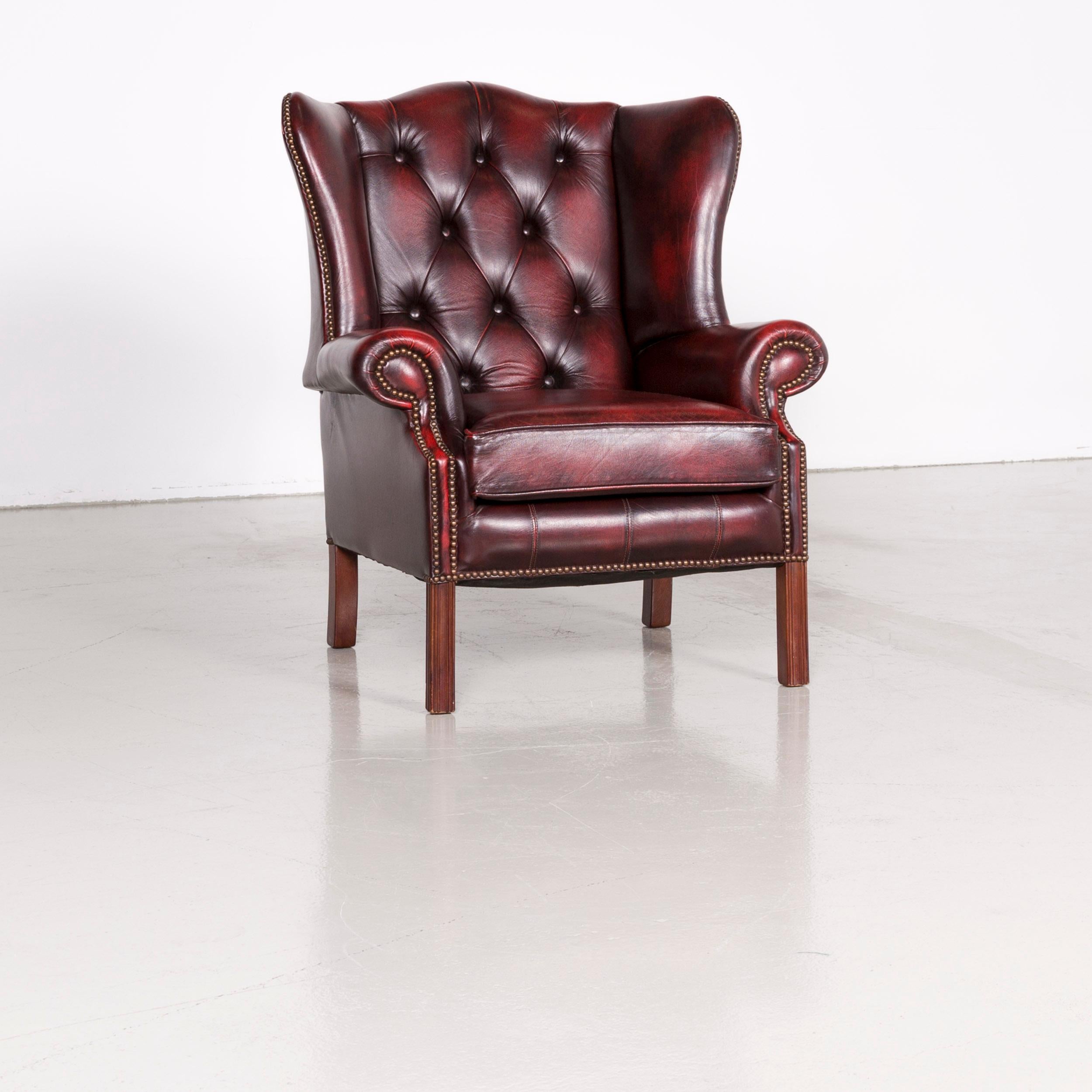 We bring to you a Centurion Chesterfield leather armchair footstool set red vintage.