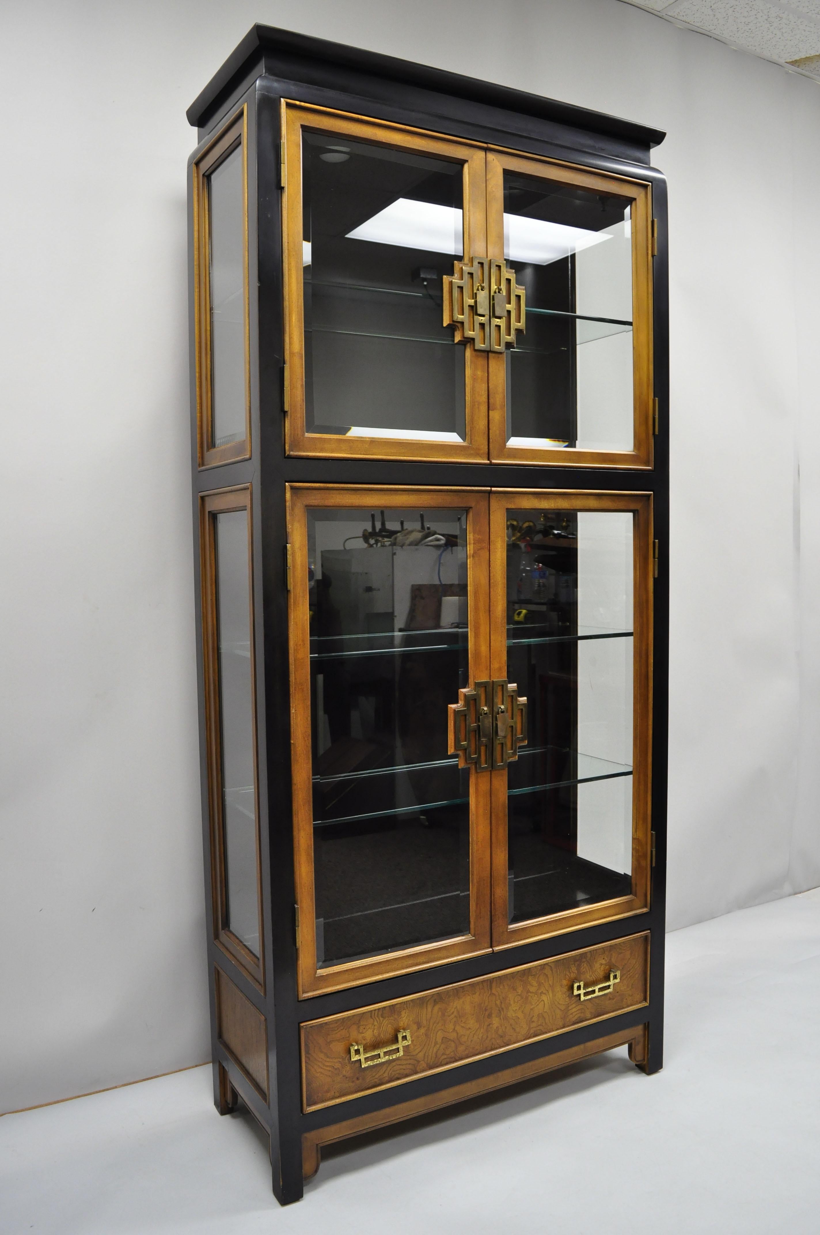 Century Chin Hua burl wood China display cabinet chinoiserie oriental curio 2 cabinets currently available. Item features solid wood construction, beautiful wood grain, lighted interior, 4 swing doors, beveled glass doors, 1 dovetailed drawers, 4