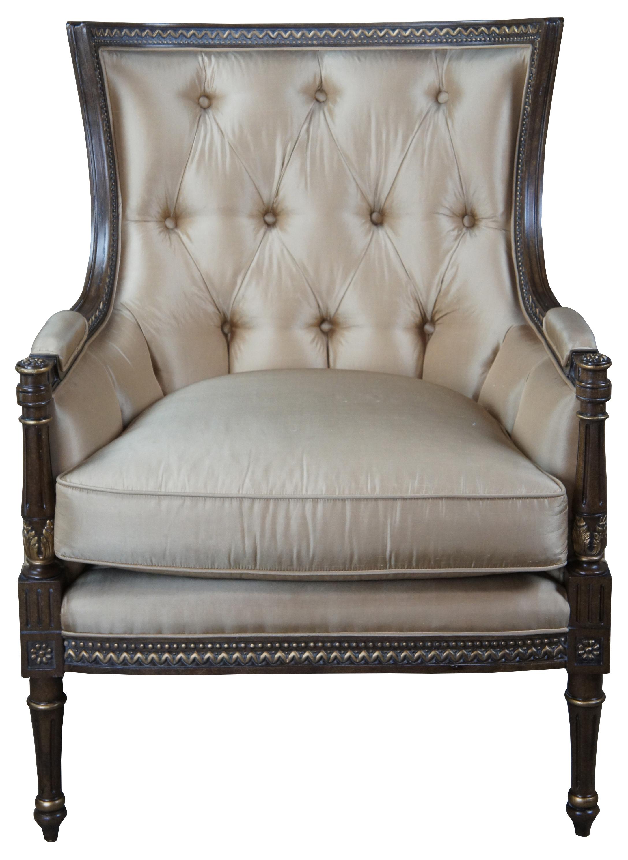 Century Furniture tufted wingback chair. Classic Louis XV styling with an intricately carved frame over reeded and tapered legs leading to arrow feet.   
  