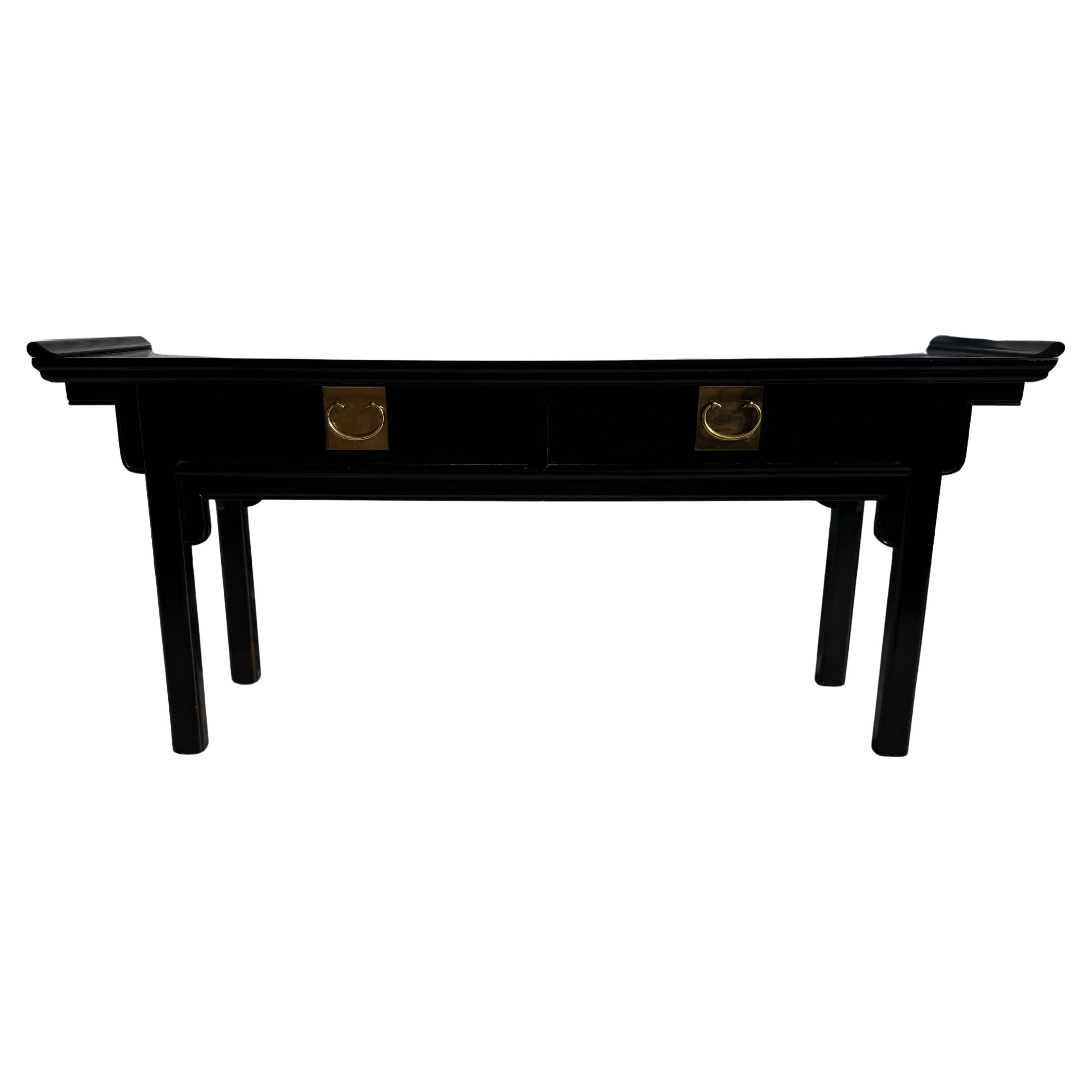 This console table was made in the Ming style.
The table resembles an altar table.
It's lacquered in Black and has beautiful brass pulls,
There are 2 drawers for storage.
