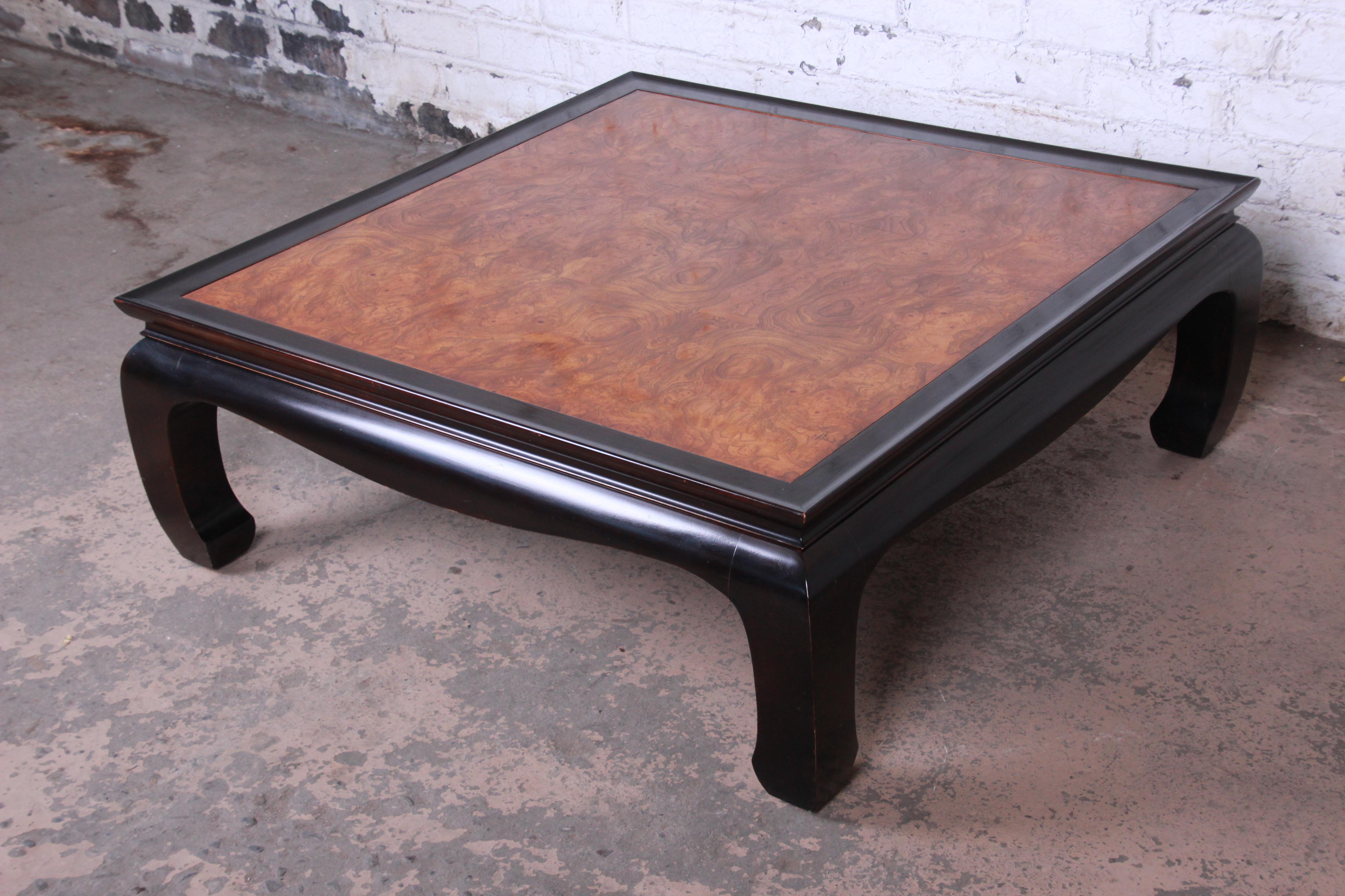 A gorgeous black lacquer and burl wood chinoiserie coffee table from the Chin Hua collection by Century Furniture. The table features stunning burl wood grain and a nice Asian design. It is in very good original vintage condition.